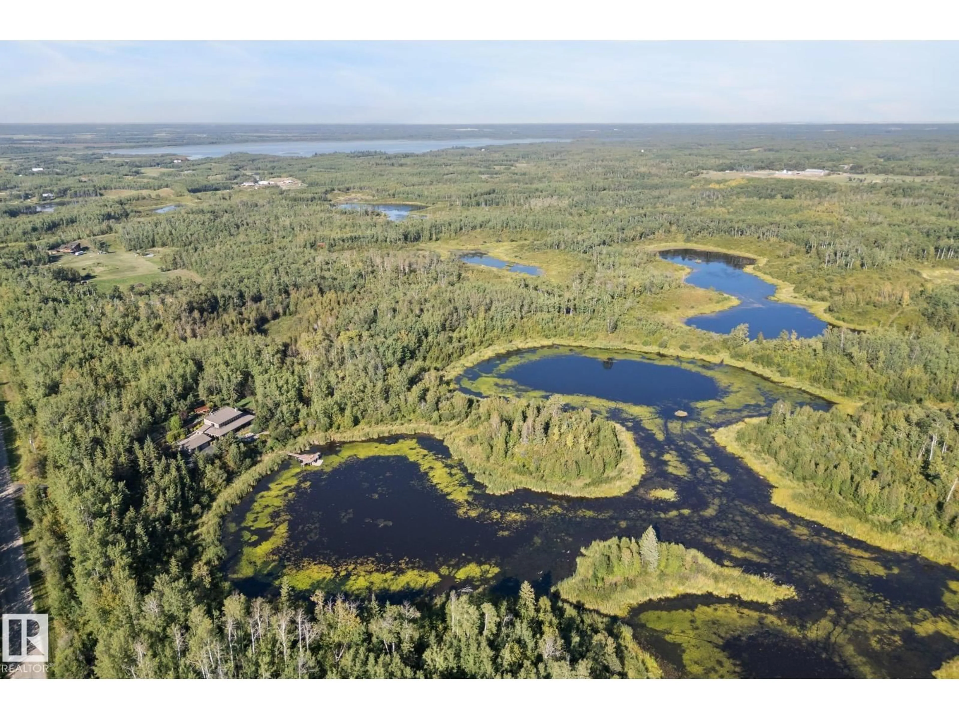 A pic from outside/outdoor area/front of a property/back of a property/a pic from drone, water/lake/river/ocean view for 51109 RGE ROAD 210, Rural Strathcona County Alberta T8G1E6