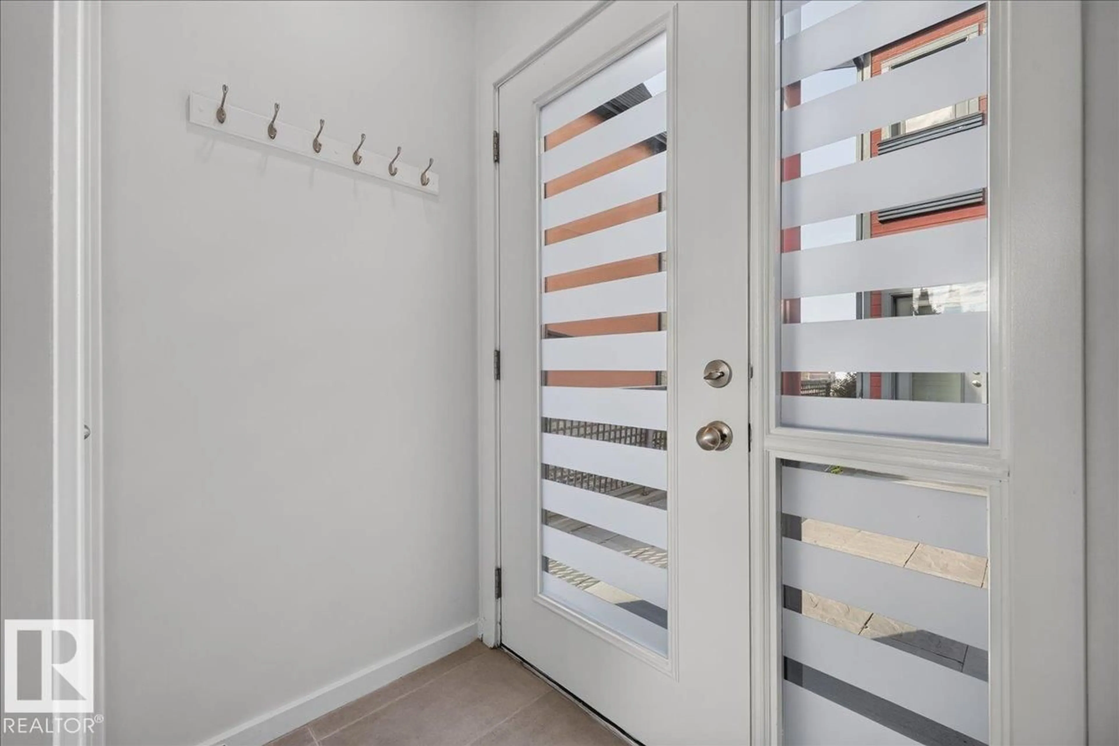 Indoor entryway for 14315 STONY PLAIN RD, Edmonton Alberta T5N3R6