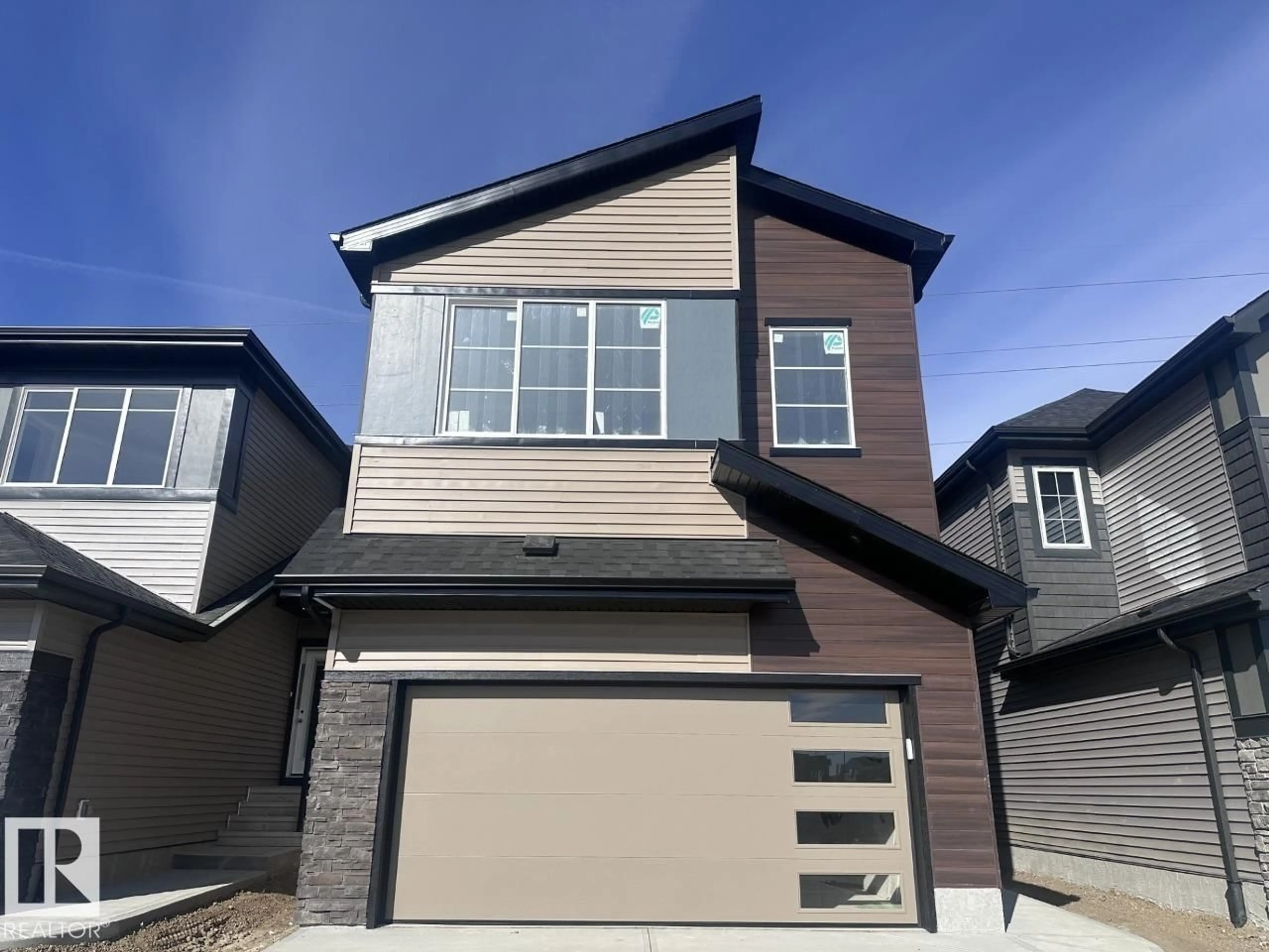 Home with vinyl exterior material, street for NW - 17232 5 ST, Edmonton Alberta T5Y6G4