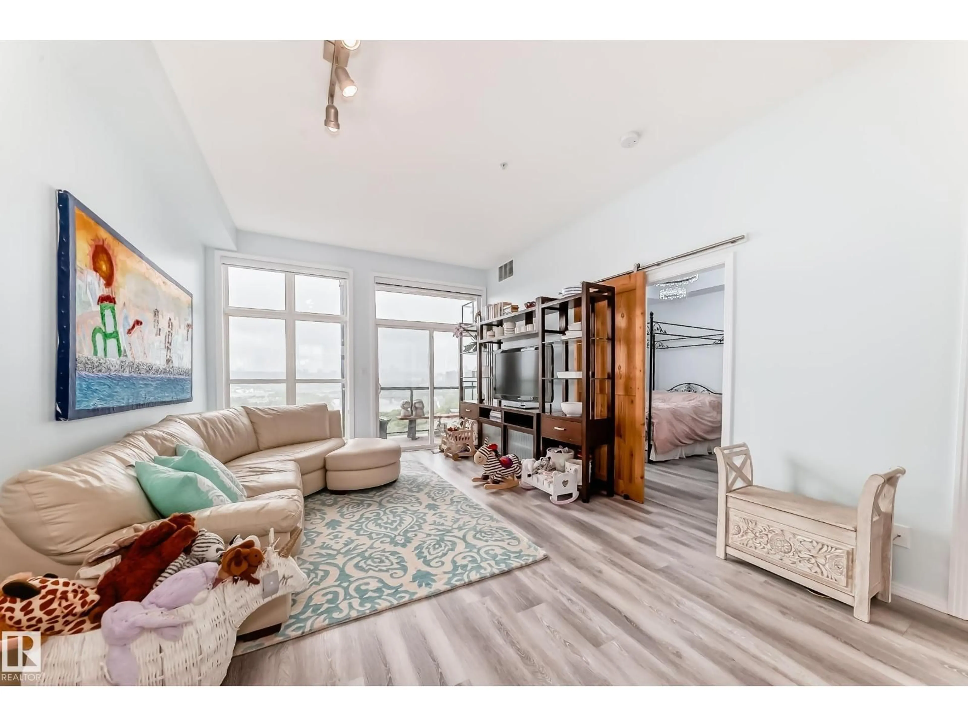 Living room with furniture, wood/laminate floor for #414 - 9507 101 AV, Edmonton Alberta T5H4R1