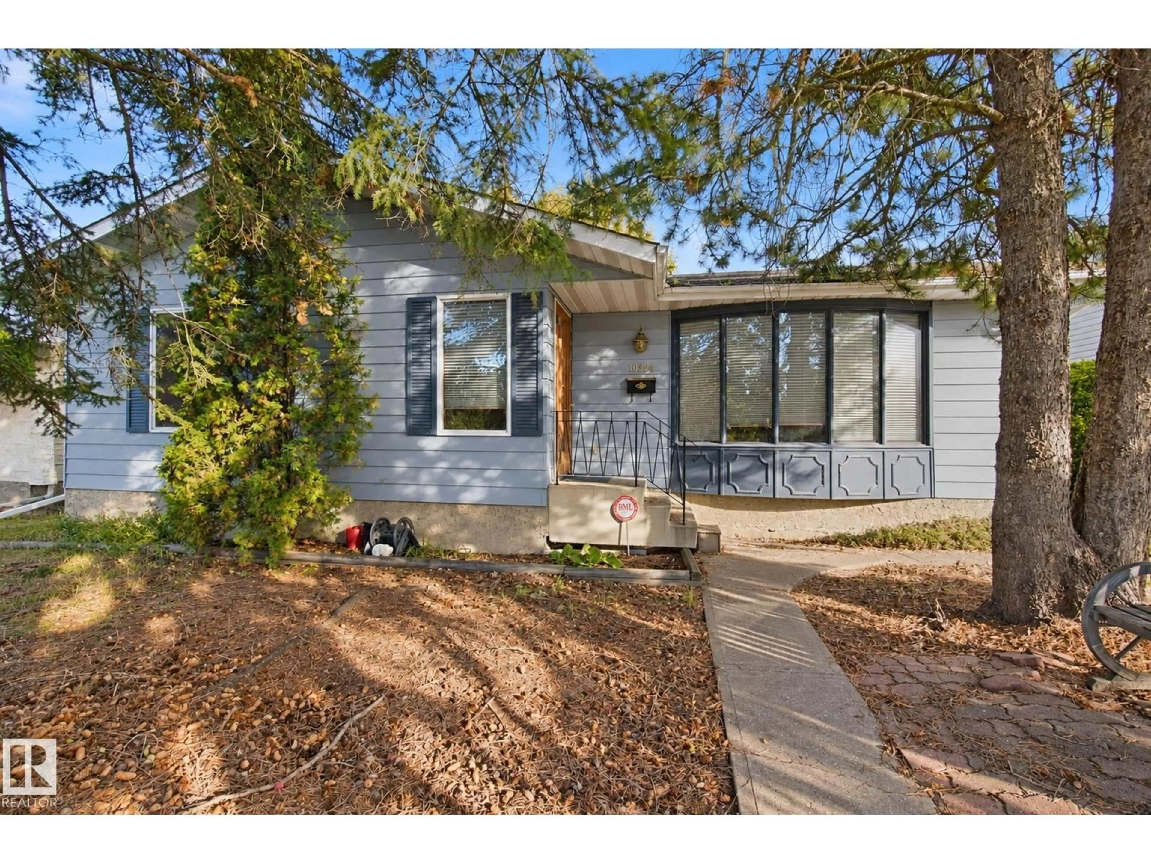 Home with vinyl exterior material, street for 10824 35 AV, Edmonton Alberta T6J2V3