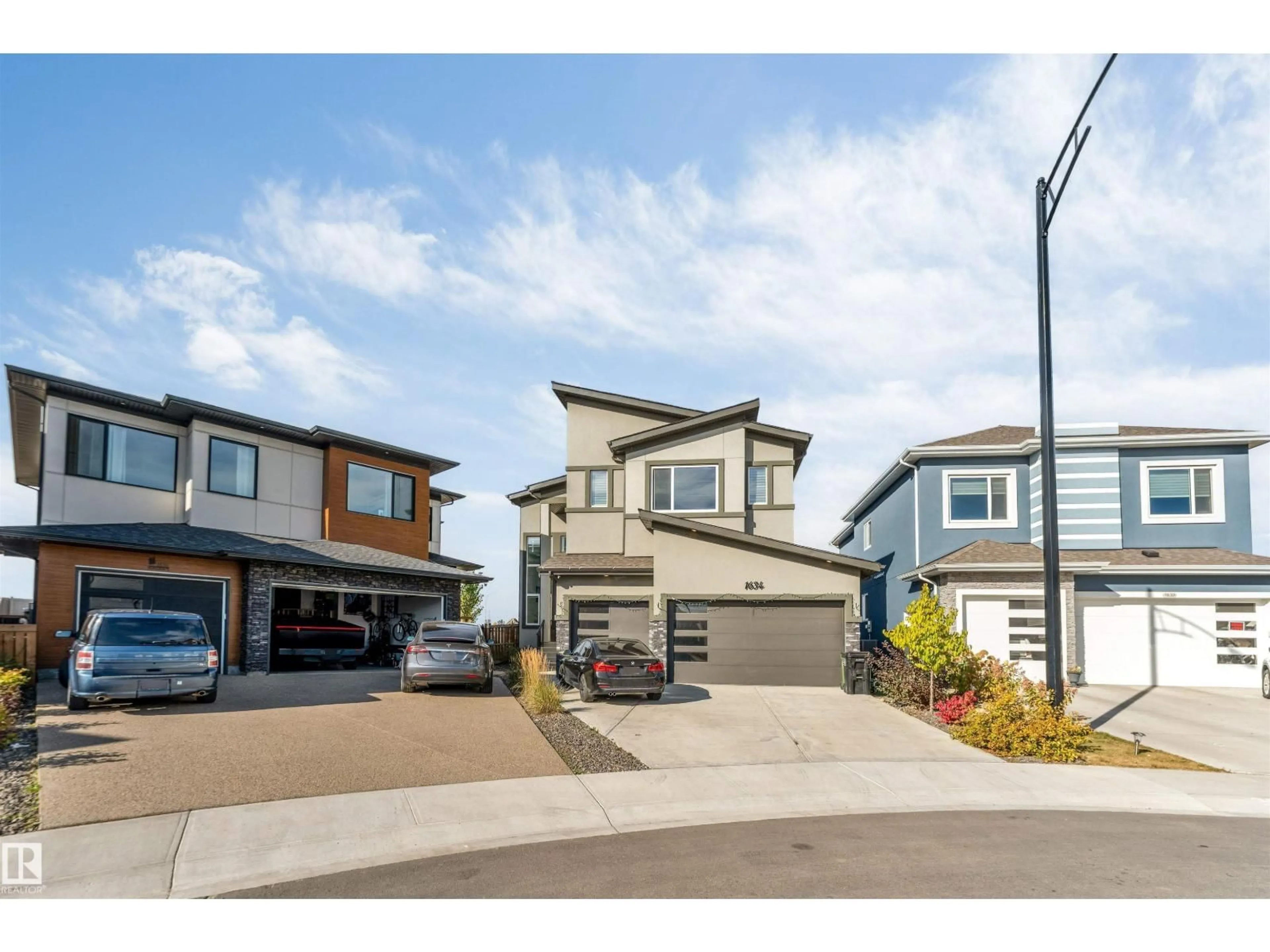 Home with vinyl exterior material, street for 1634 16A ST, Edmonton Alberta T6T2S1