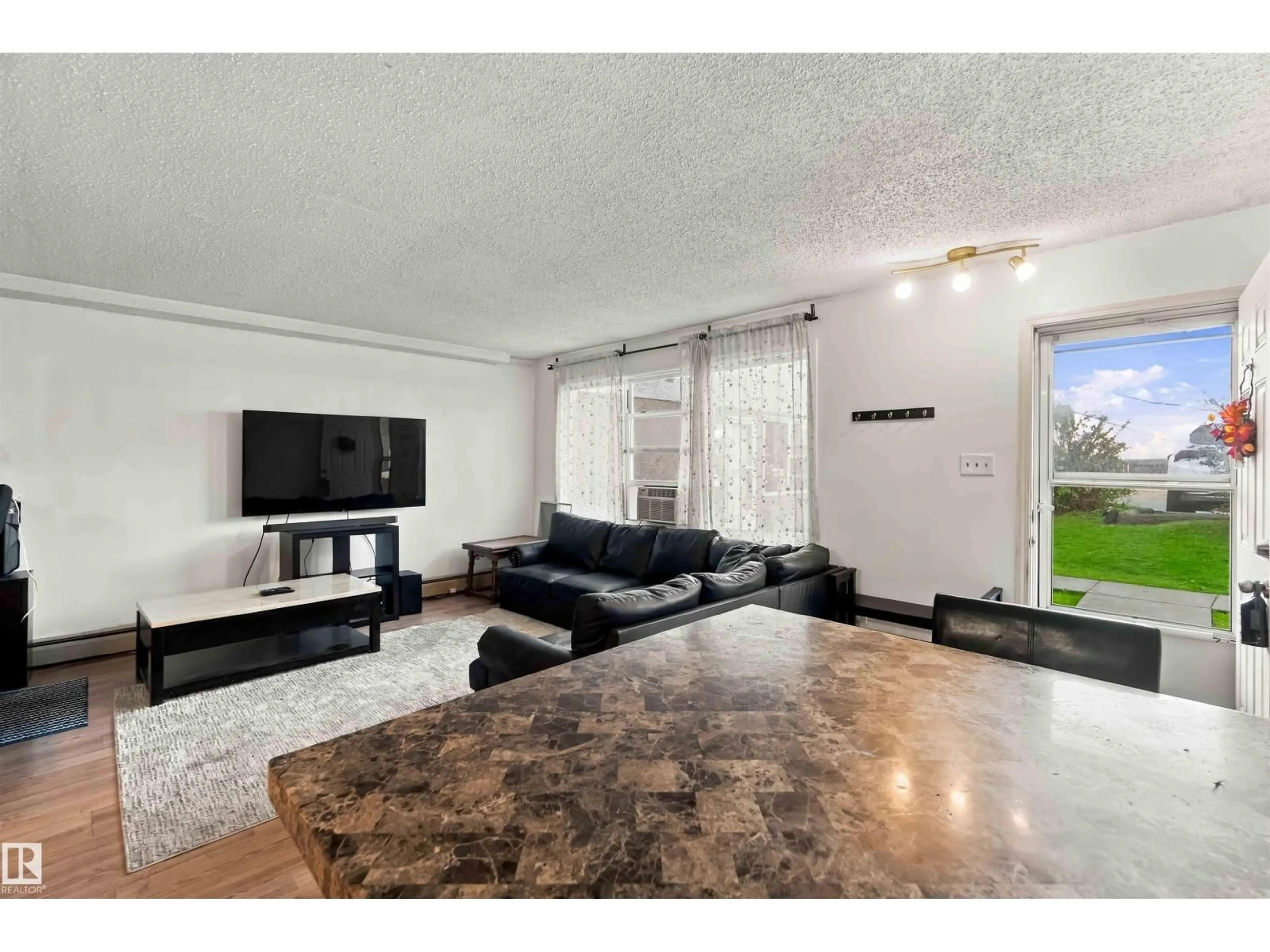 Living room with furniture, unknown for 48 13590 38 ST NW, Edmonton Alberta T5A2W7