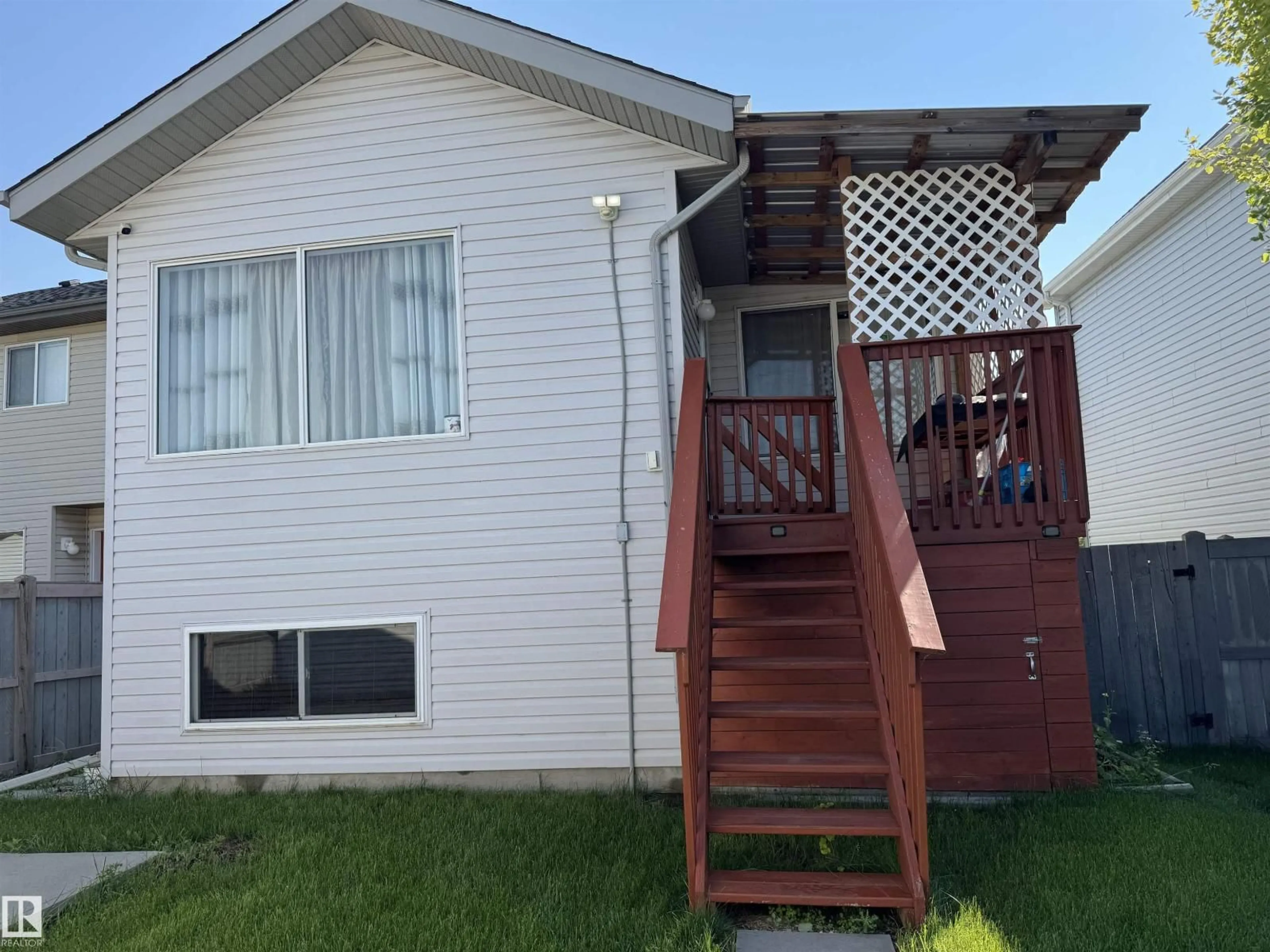 Home with vinyl exterior material, street for 15112 139 ST, Edmonton Alberta T6V1T7