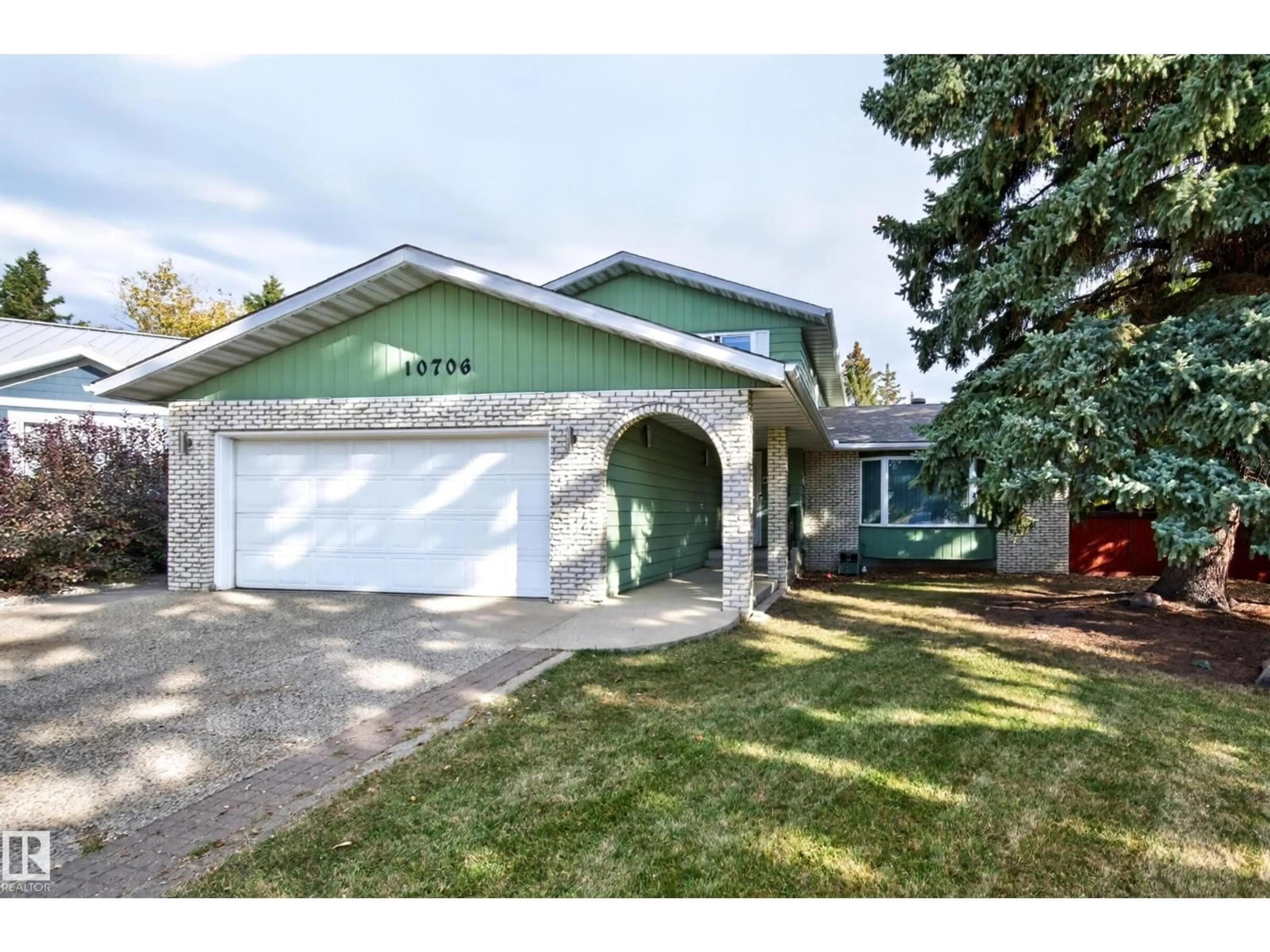 Home with vinyl exterior material, street for 10706 33A AV, Edmonton Alberta T6J3B7