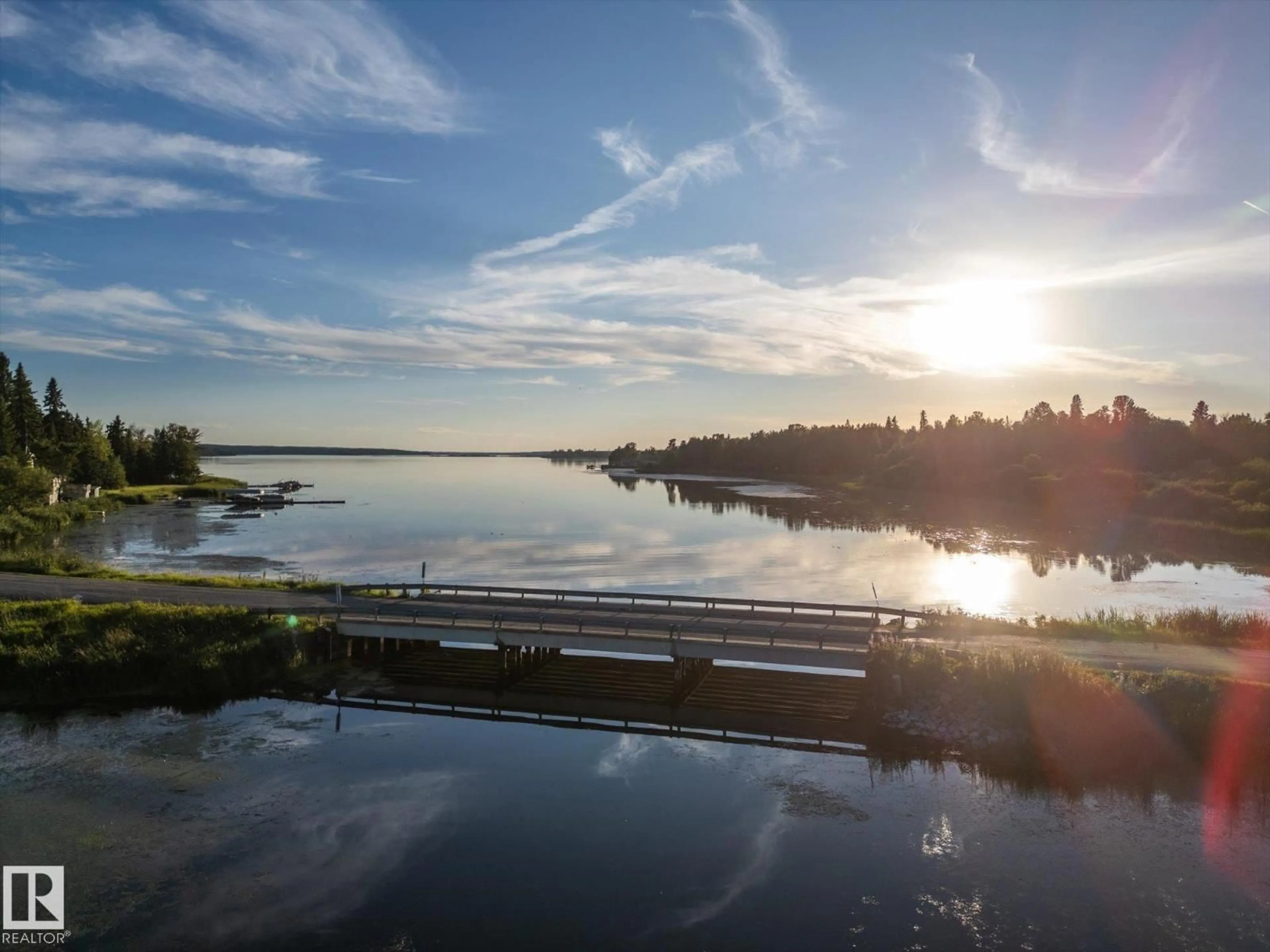 A pic from outside/outdoor area/front of a property/back of a property/a pic from drone, water/lake/river/ocean view for 49 - 5323 TOWNSHIP ROAD 541A, Rural Lac Ste. Anne County Alberta T0E1H0