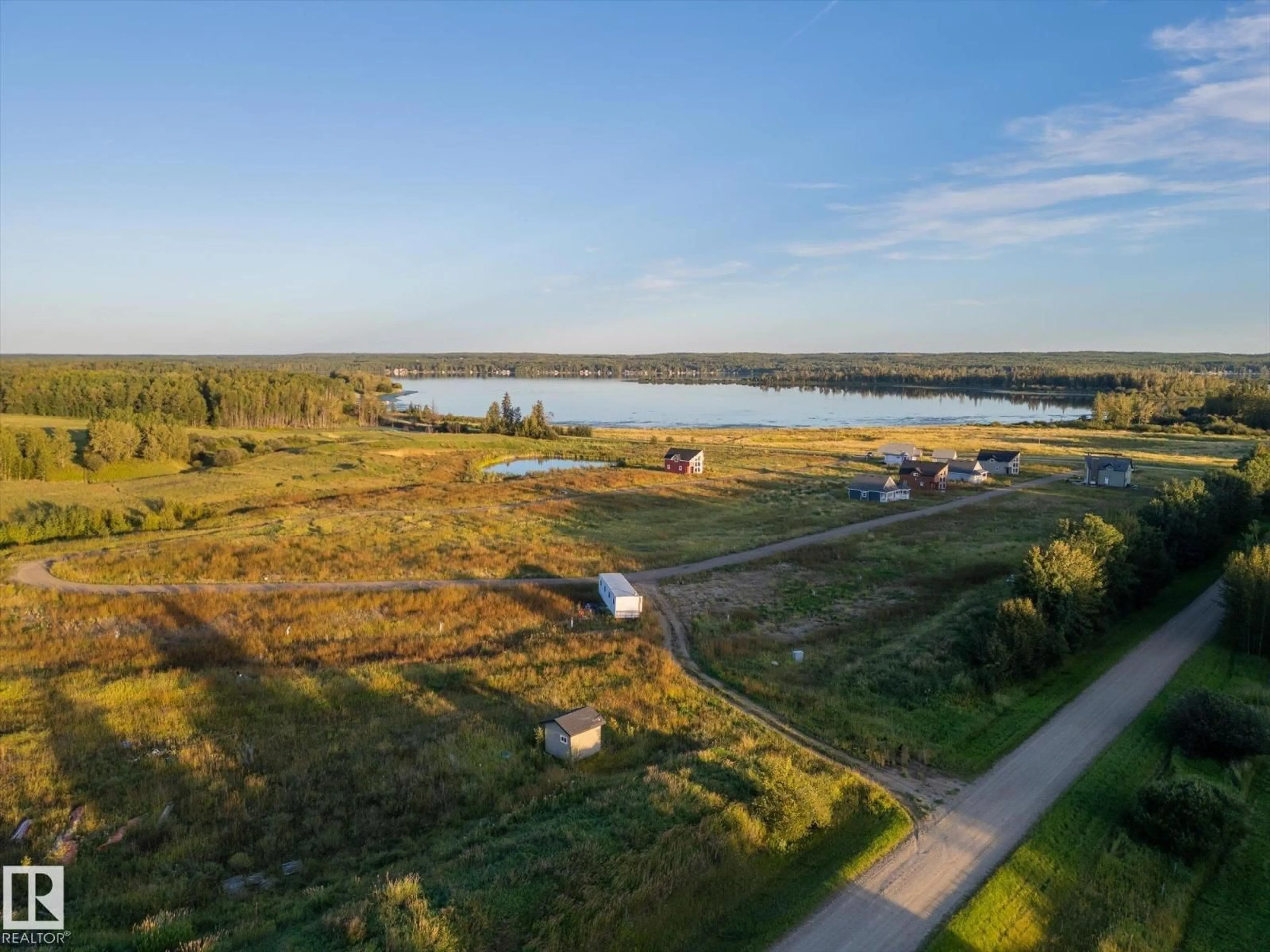 A pic from outside/outdoor area/front of a property/back of a property/a pic from drone, water/lake/river/ocean view for 49 - 5323 TOWNSHIP ROAD 541A, Rural Lac Ste. Anne County Alberta T0E1H0