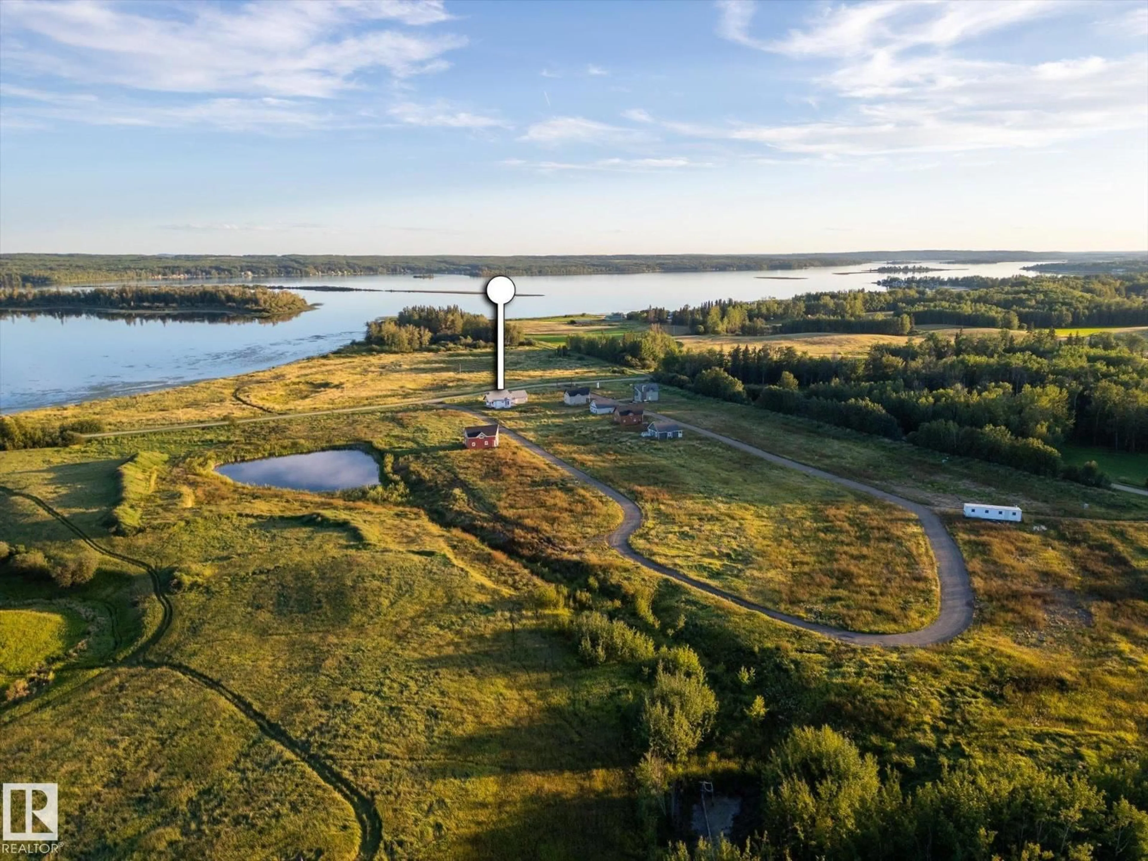 A pic from outside/outdoor area/front of a property/back of a property/a pic from drone, water/lake/river/ocean view for 49 - 5323 TOWNSHIP ROAD 541A, Rural Lac Ste. Anne County Alberta T0E1H0