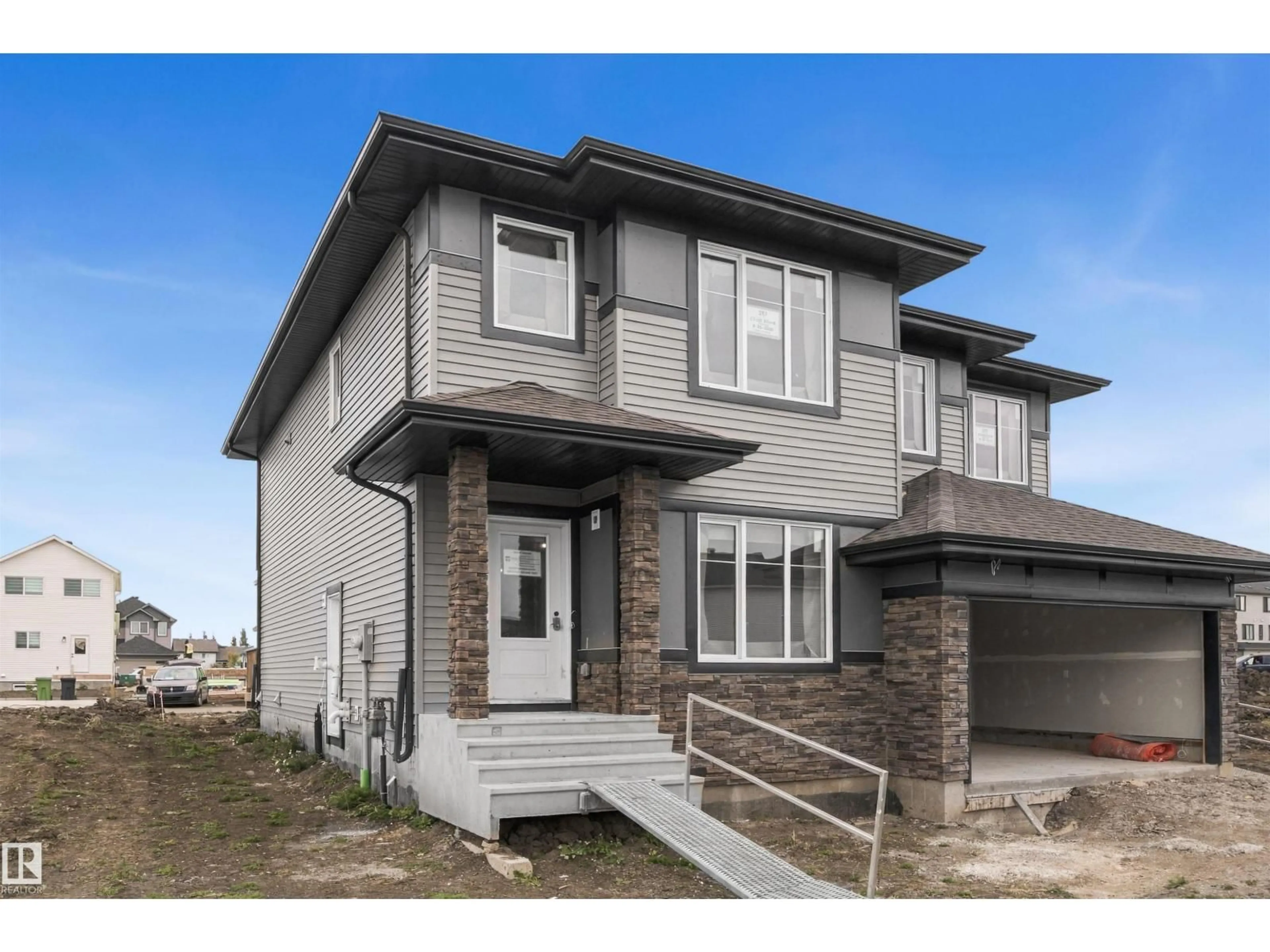 Home with brick exterior material, street for 287 ELLIOTT WD, Fort Saskatchewan Alberta T8L3X6