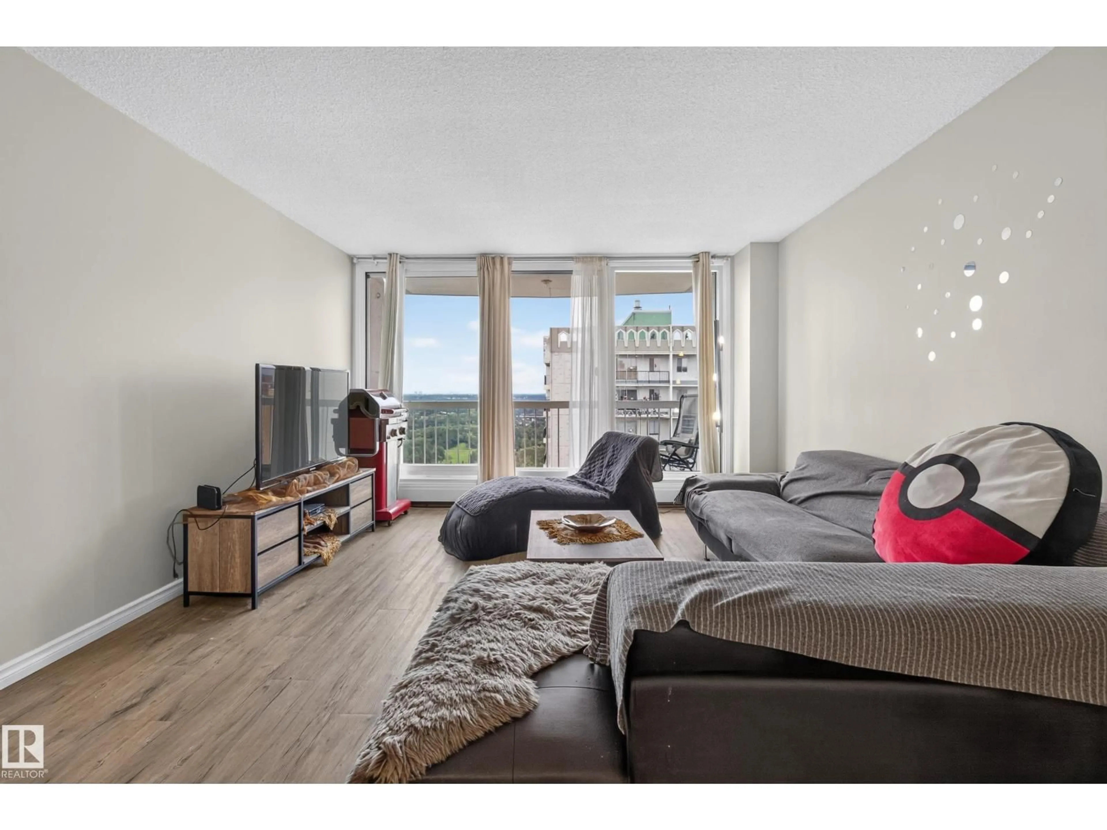 Living room with furniture, wood/laminate floor for 1704 - 9835 113 ST, Edmonton Alberta T5K1N4