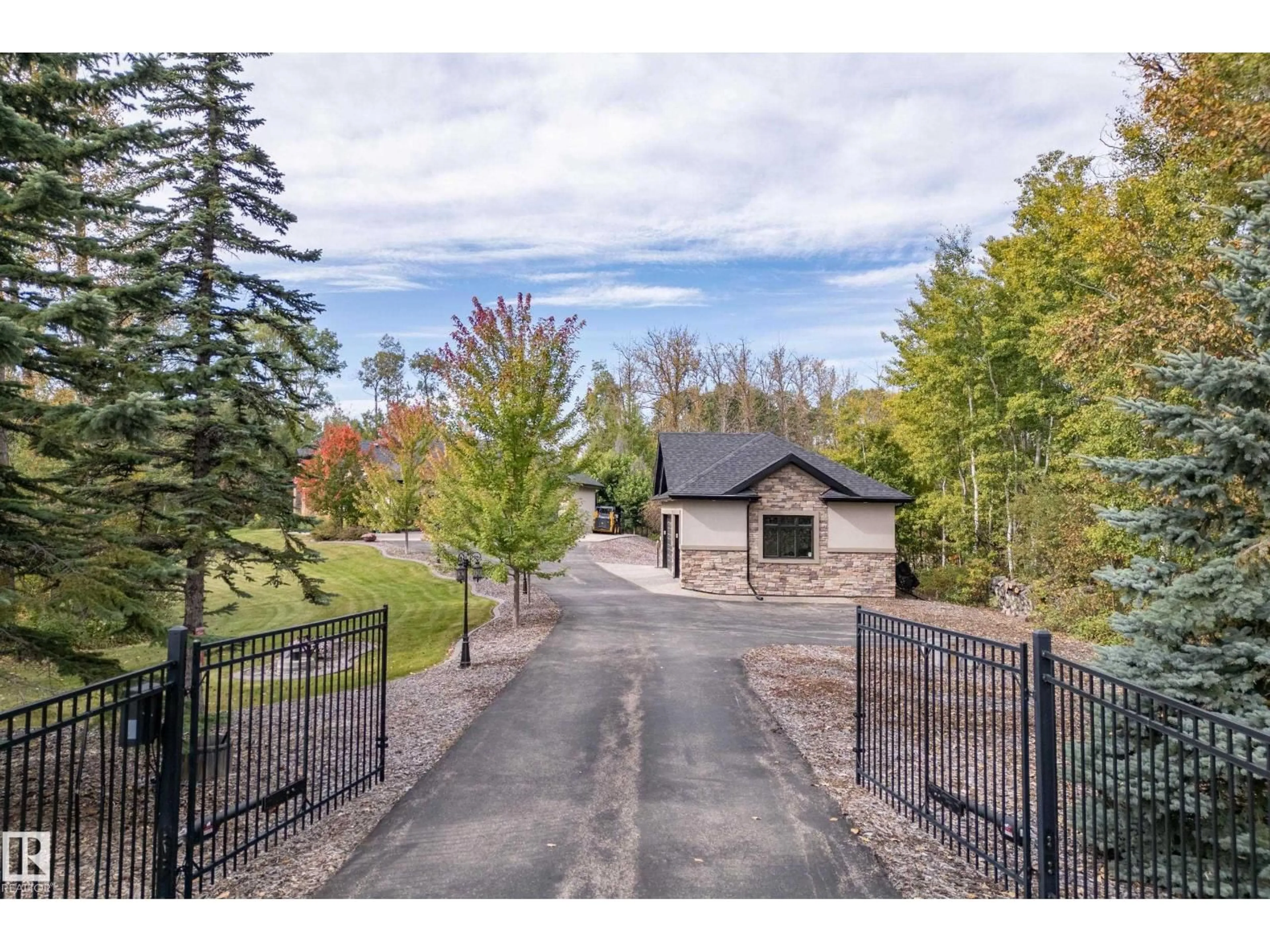 A pic from outside/outdoor area/front of a property/back of a property/a pic from drone, street for #14 - 53424 RGE ROAD 274, Rural Parkland County Alberta T7X3T1