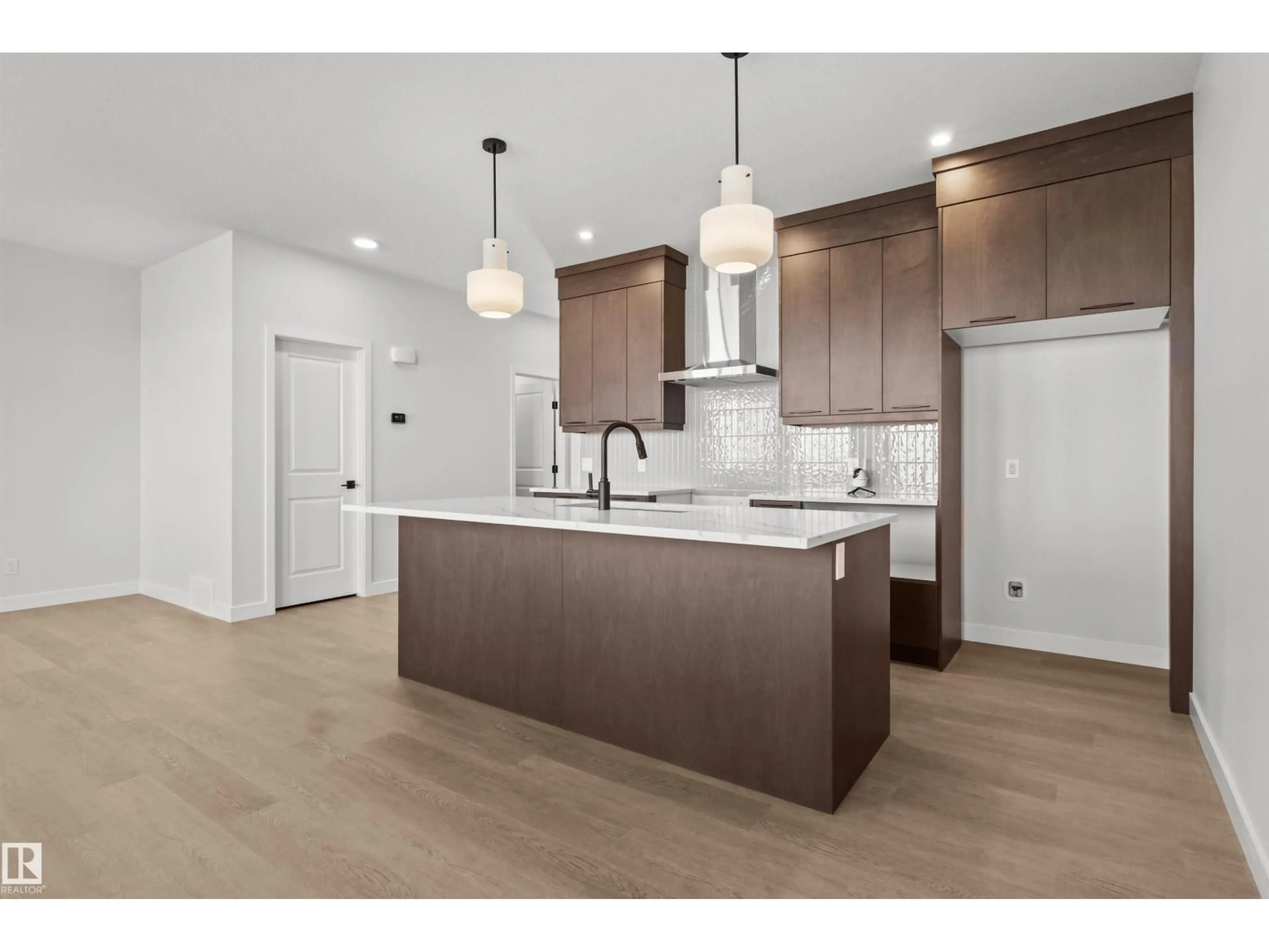 Open concept kitchen, wood/laminate floor for SW - 3408 126 ST, Edmonton Alberta T6W5Z8