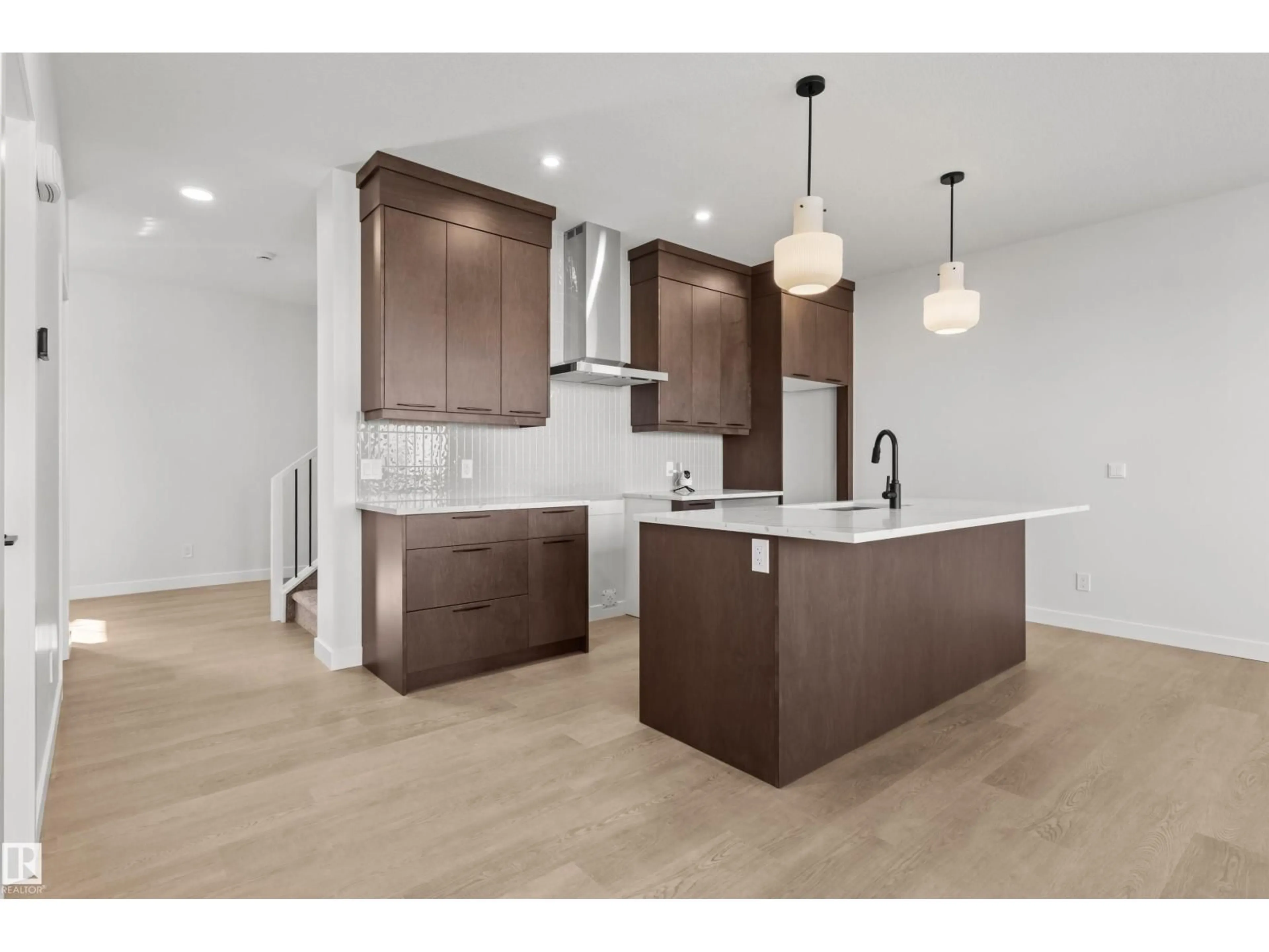 Open concept kitchen, wood/laminate floor for SW - 3408 126 ST, Edmonton Alberta T6W5Z8