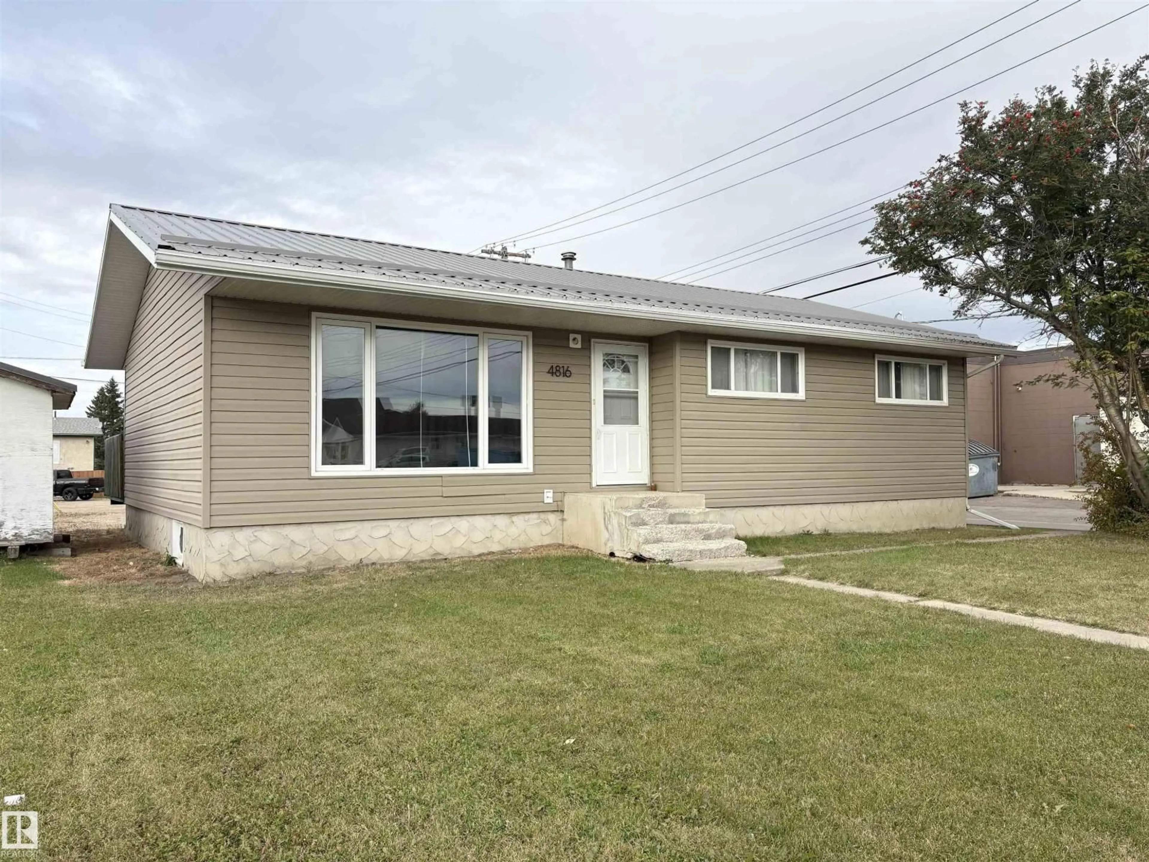 Home with vinyl exterior material, street for 4816 54 ST, Bonnyville Town Alberta T9N1Y9