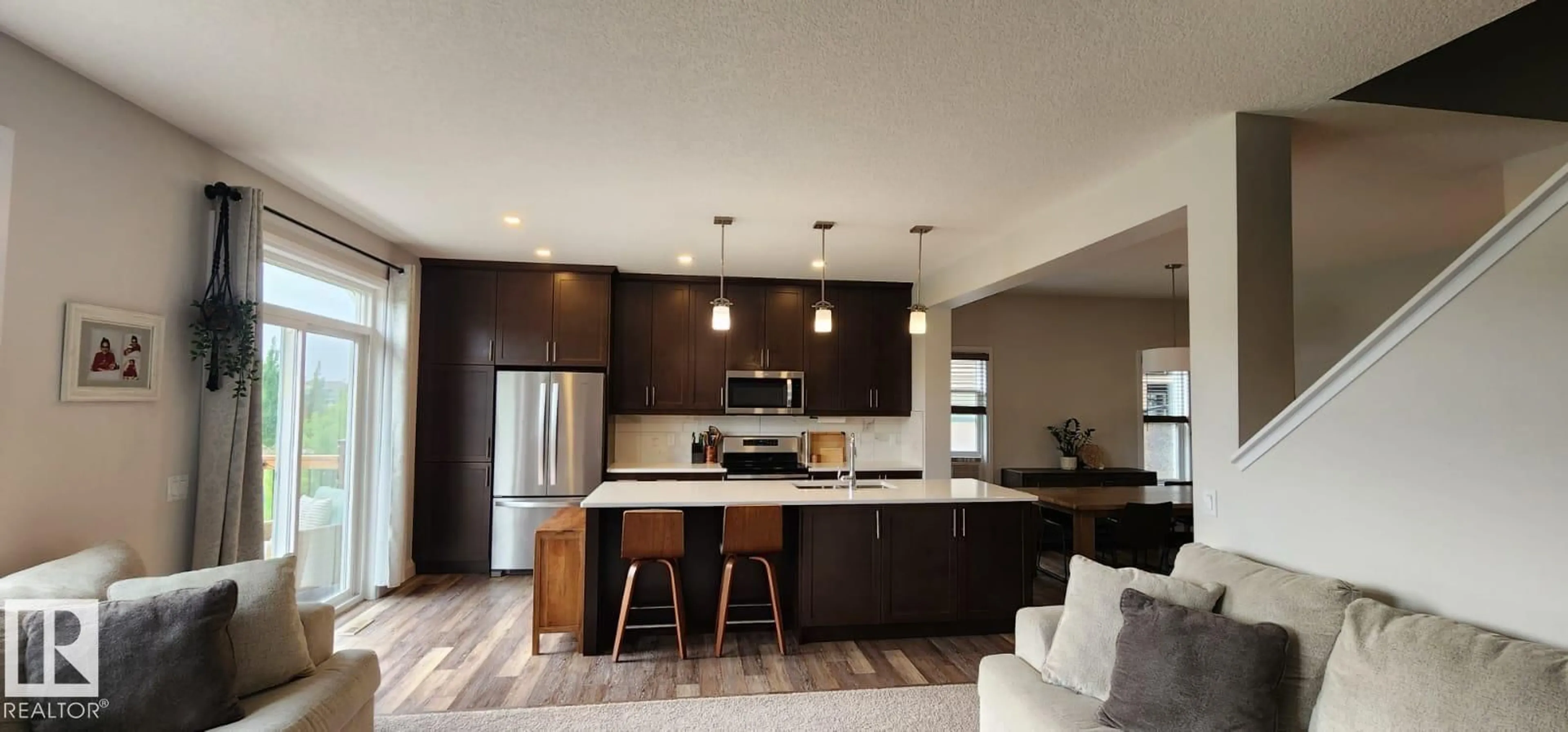 Open concept kitchen, wood/laminate floor for SW - 3779 CHERRY LO N, Edmonton Alberta T6X2K8