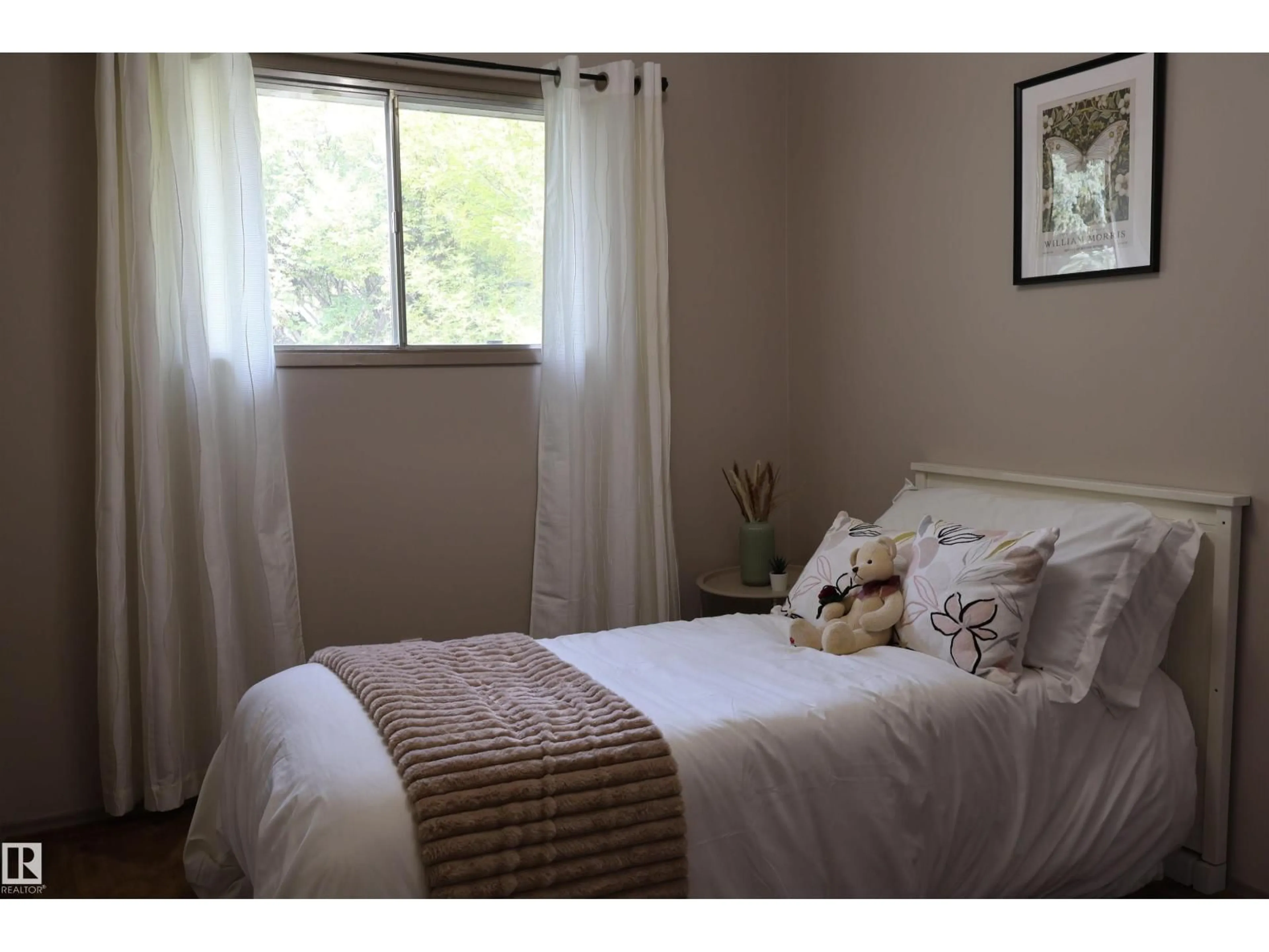 Bedroom with bed, wood/laminate floor for NW - 3819 115 AV, Edmonton Alberta T5W0V2