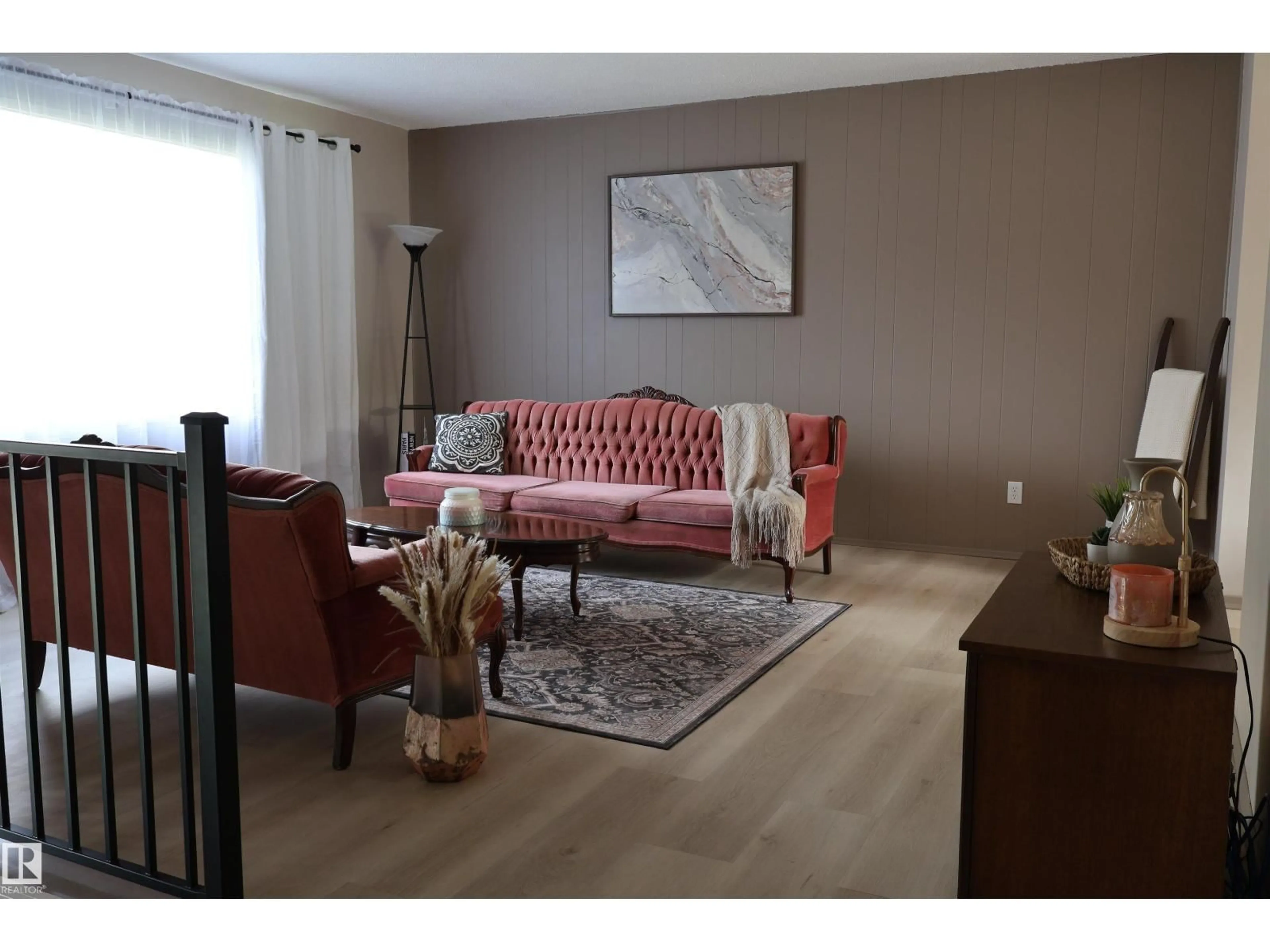 Living room with furniture, wood/laminate floor for NW - 3819 115 AV, Edmonton Alberta T5W0V2