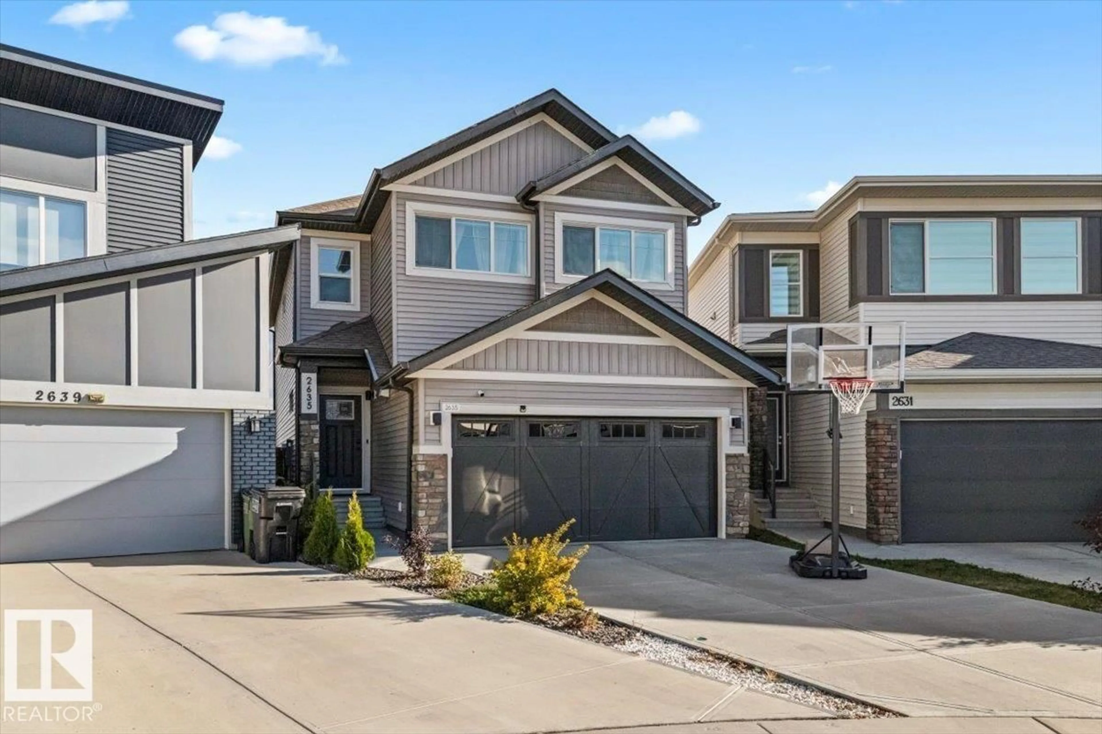 Home with vinyl exterior material, street for NW - 2635 200 ST, Edmonton Alberta T6M1K3