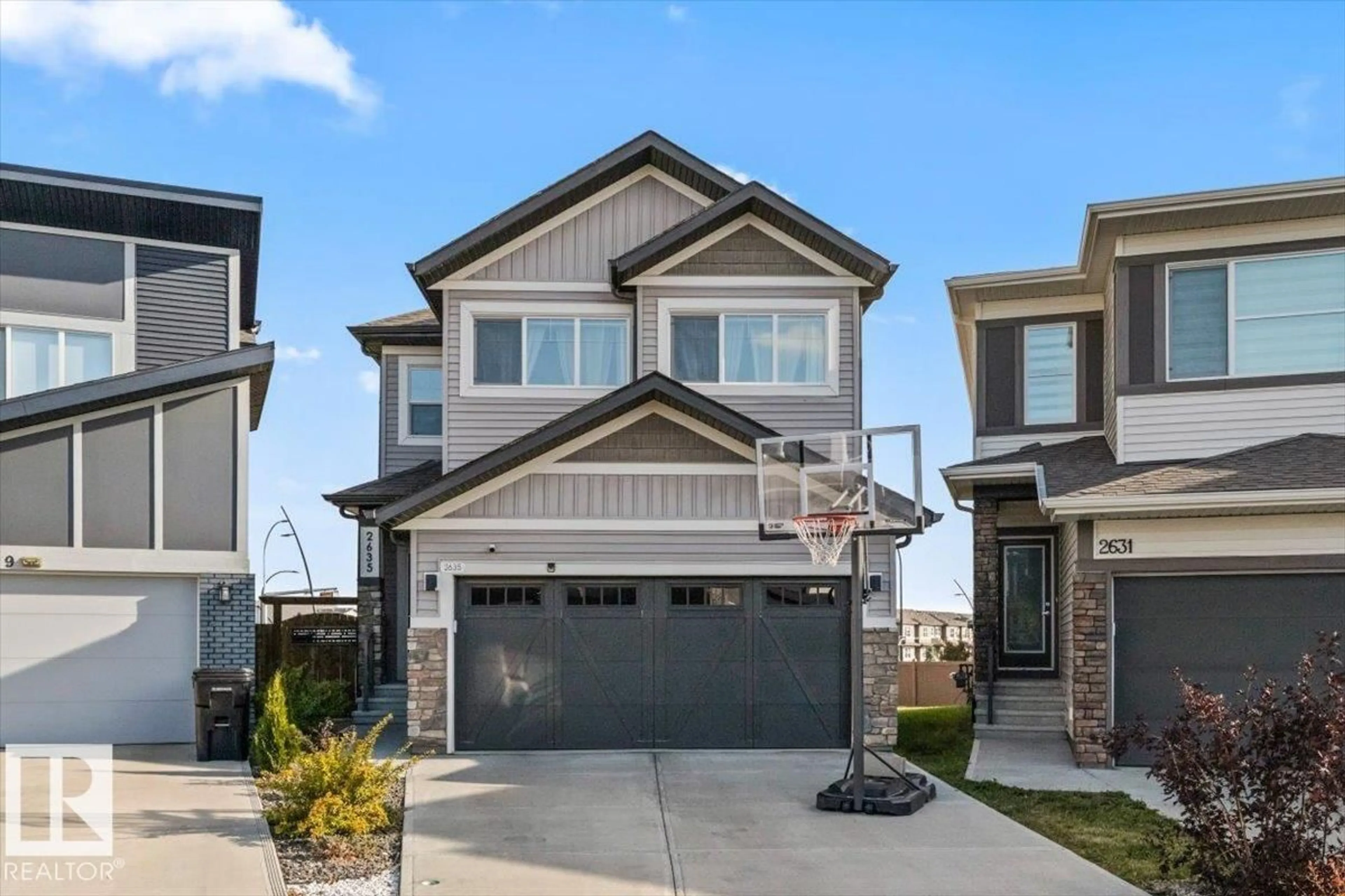 Home with vinyl exterior material, street for NW - 2635 200 ST, Edmonton Alberta T6M1K3