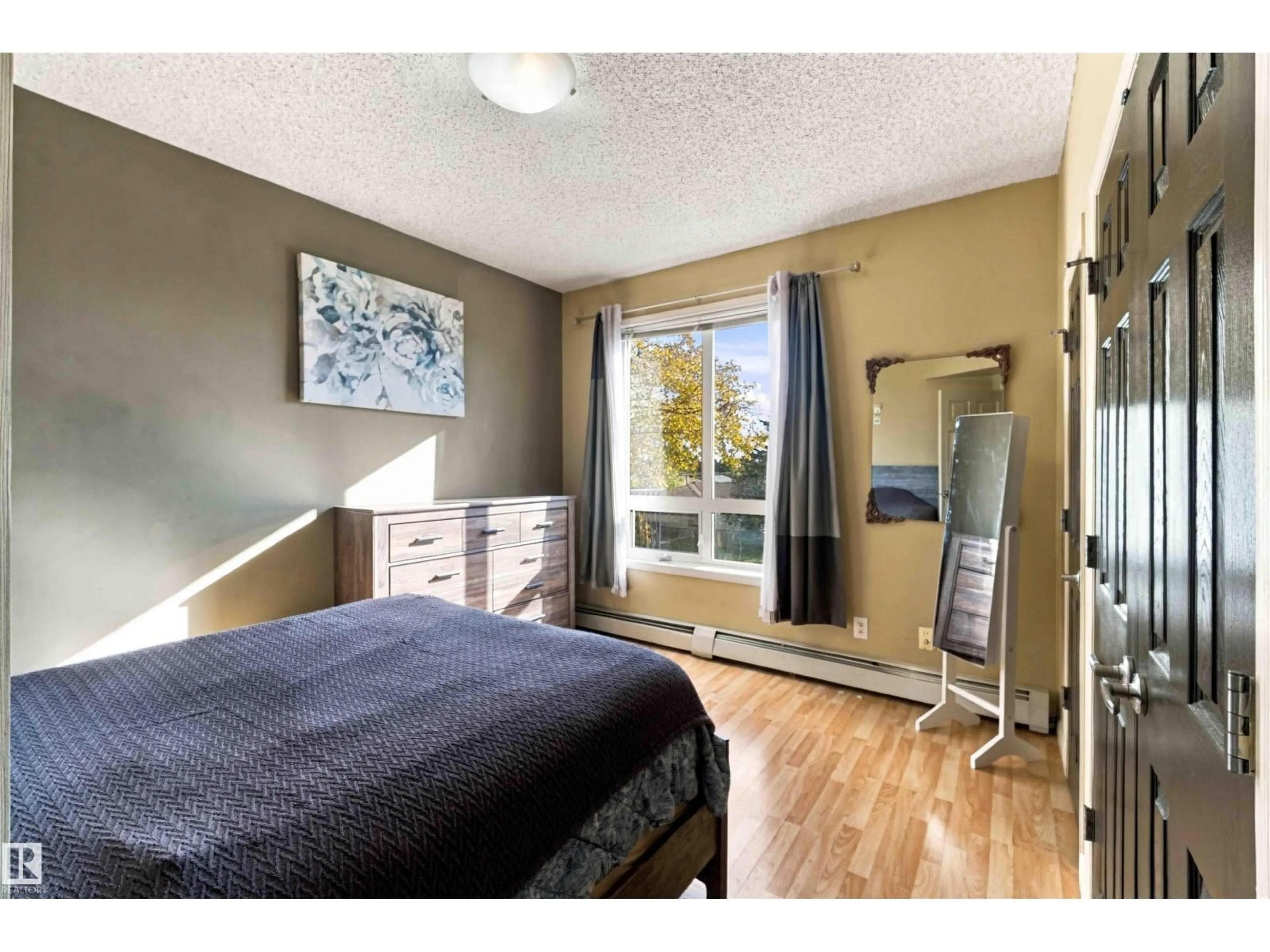 Bedroom with bed, unknown for #202 - 6220 134 AV, Edmonton Alberta T5A0A8