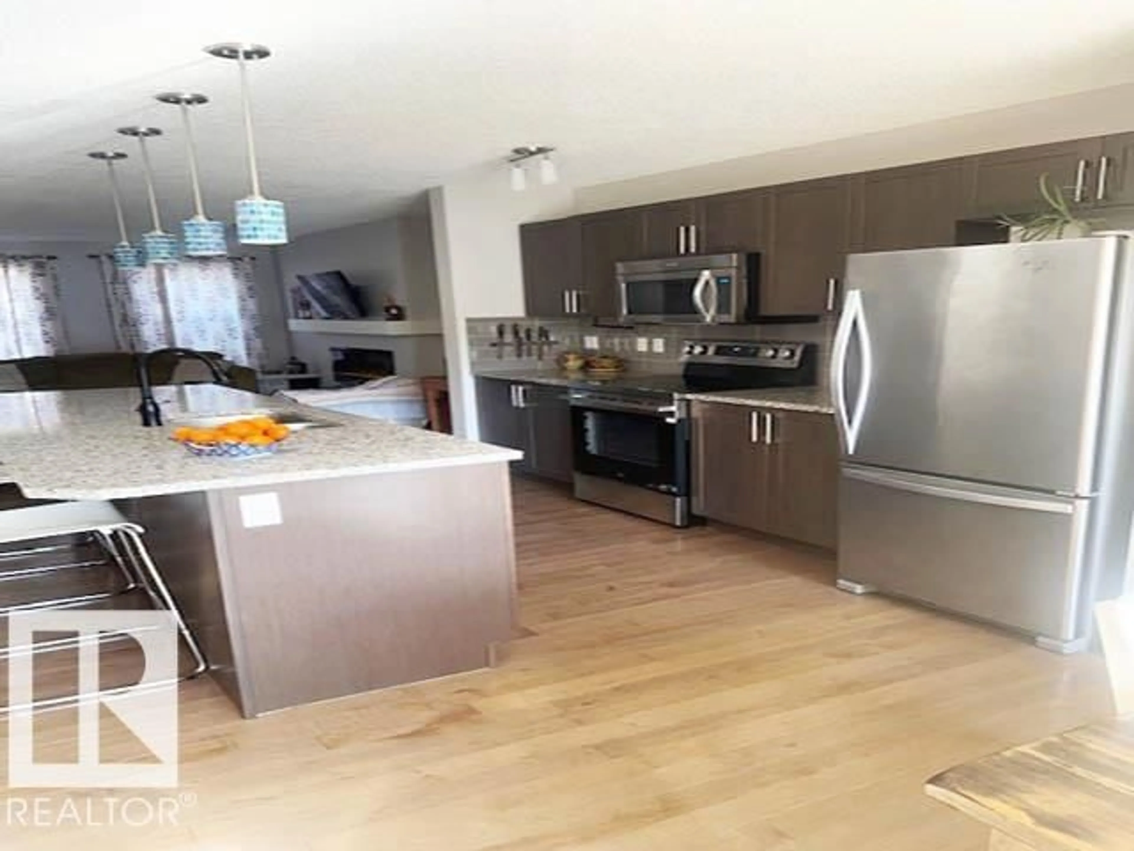 Open concept kitchen, wood/laminate floor for 8323 ELISS CRESCENT, Edmonton Alberta T6M0P8