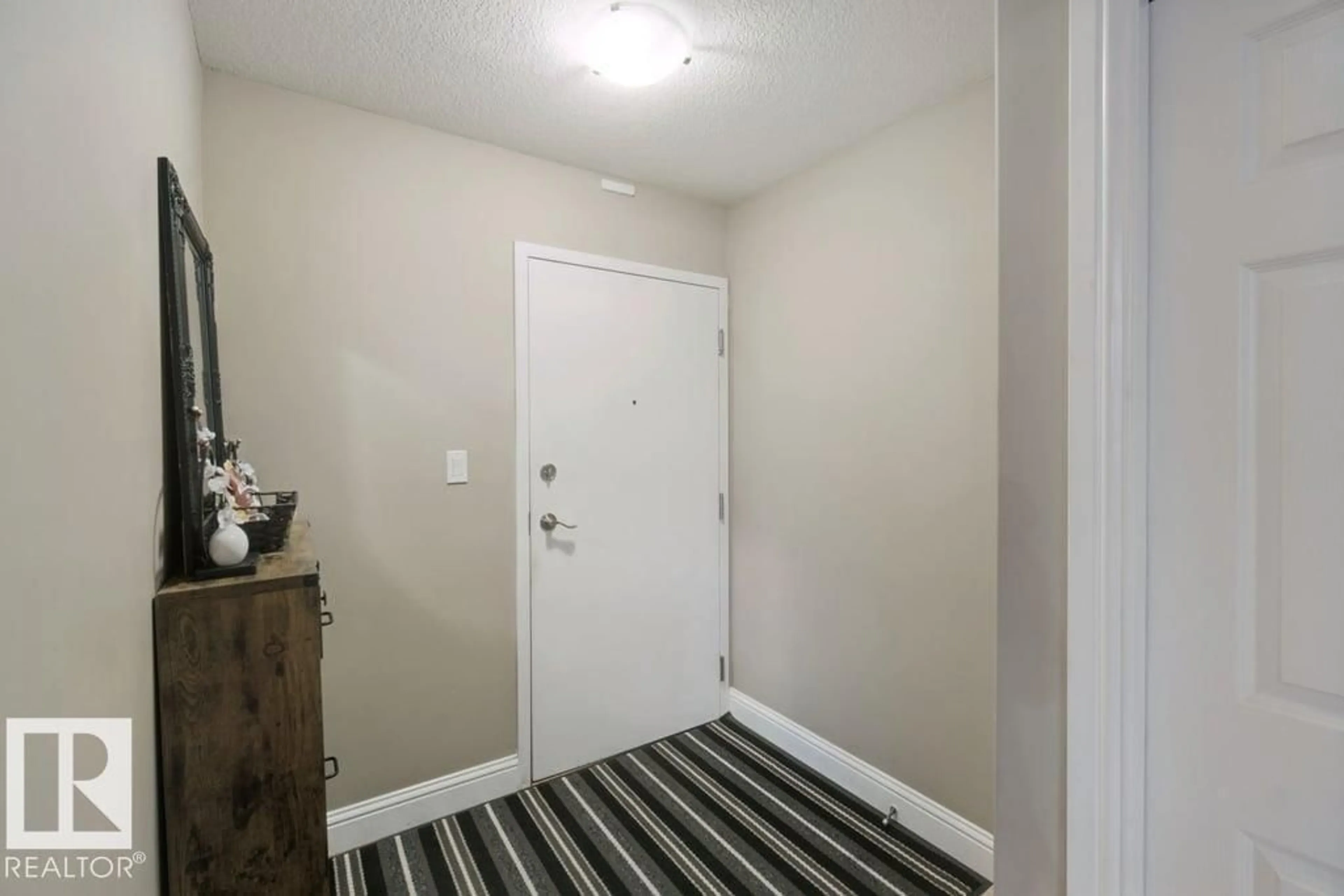 Indoor entryway for #212 - 13005 140 AV, Edmonton Alberta T6V1X1