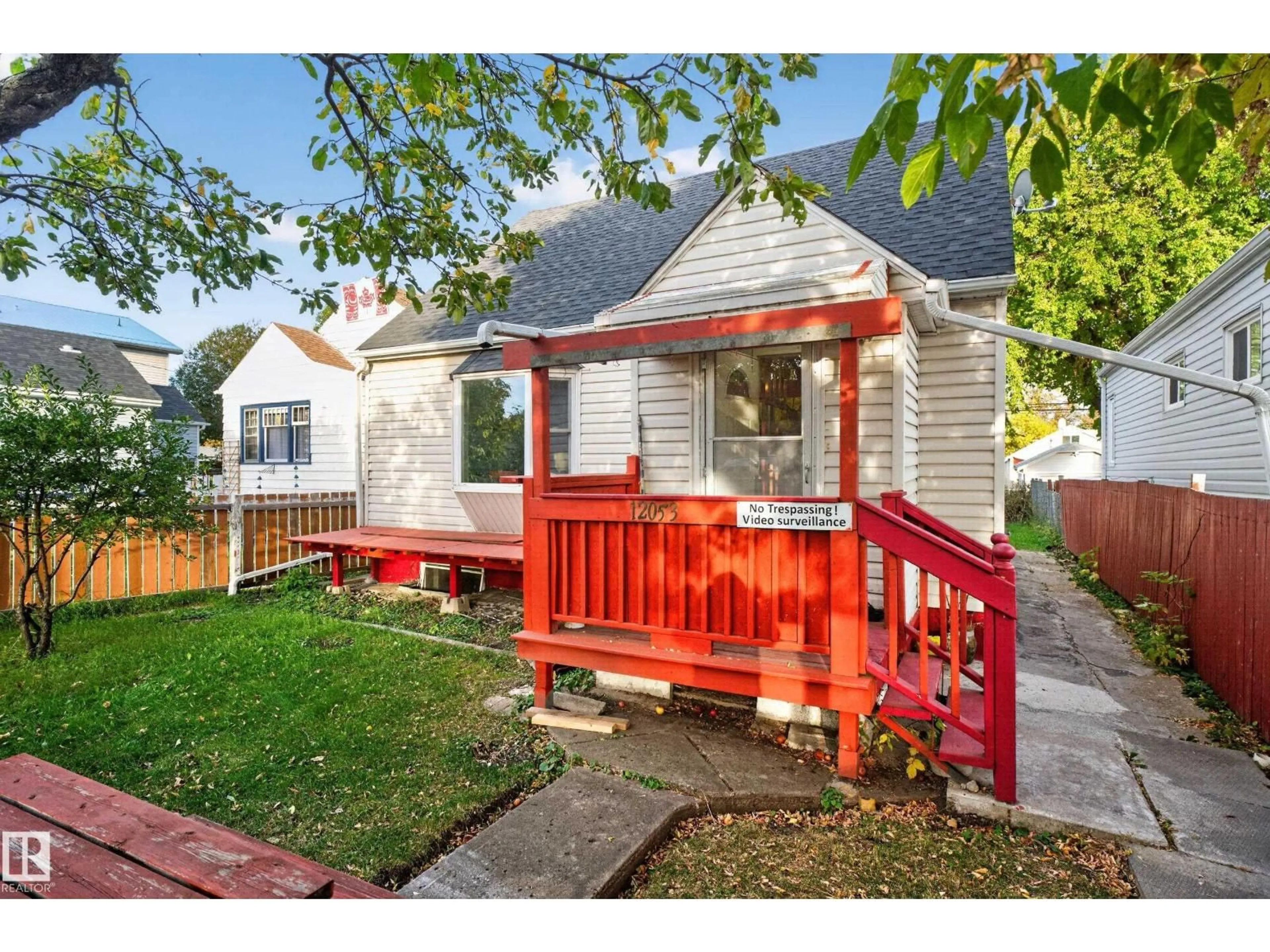 Home with vinyl exterior material, street for 12053 97 ST, Edmonton Alberta T5G1Y8