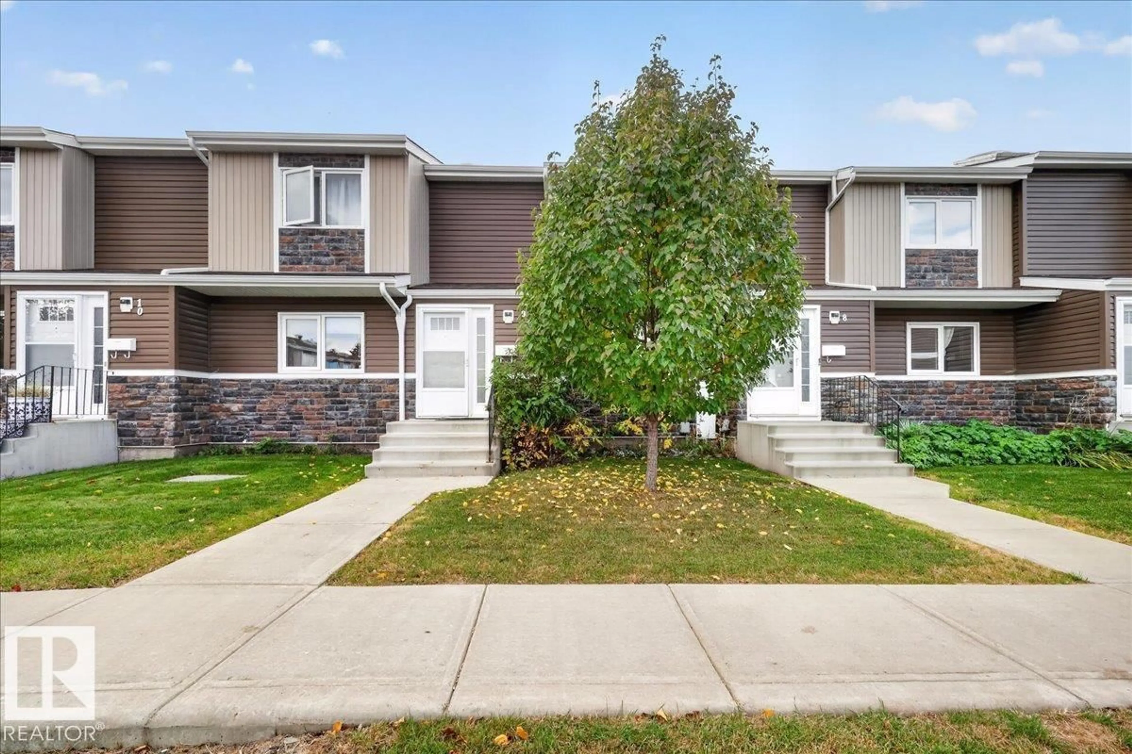 Home with vinyl exterior material, street for 9 - 3115 119 ST, Edmonton Alberta T6J5N5