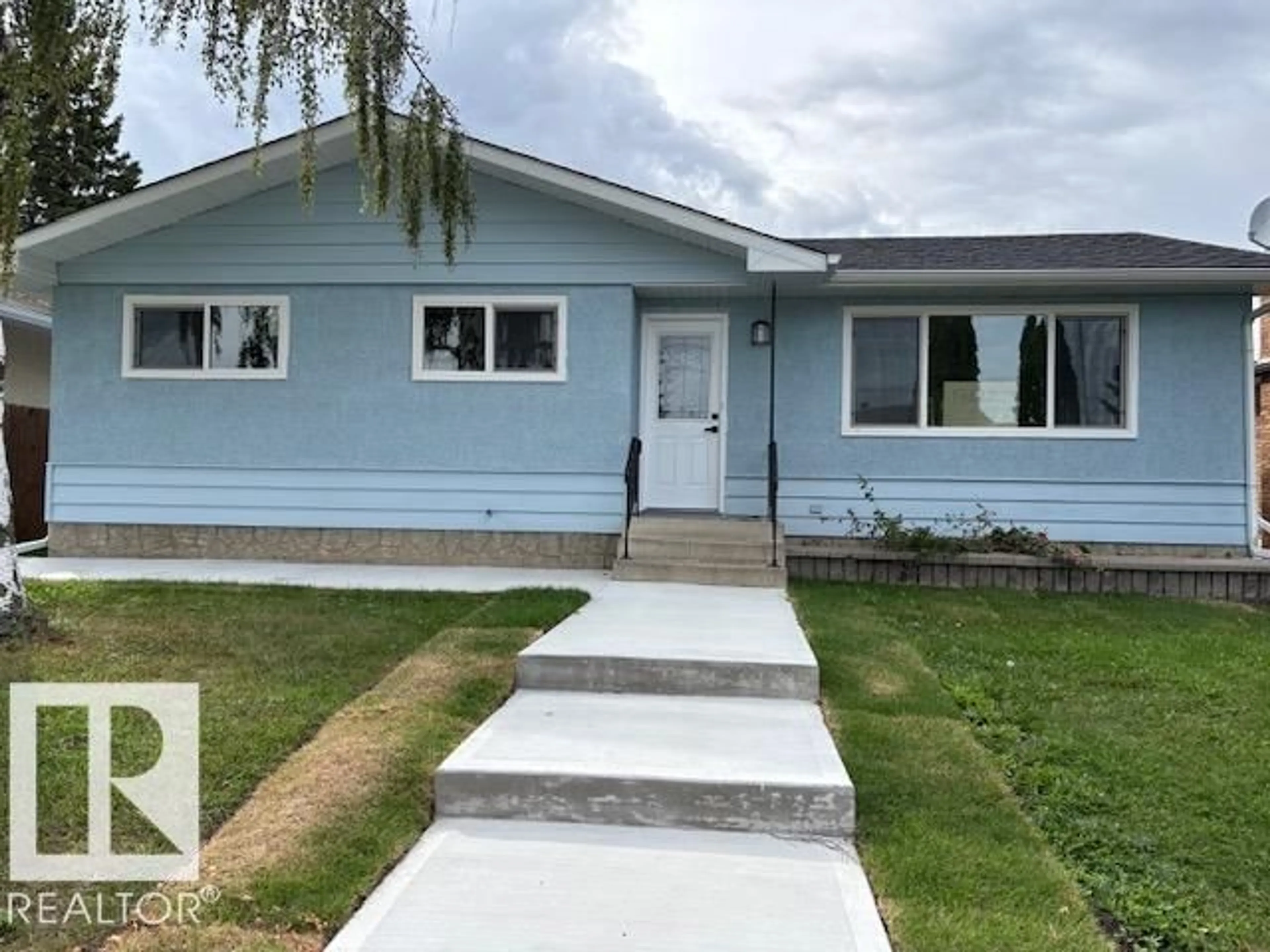 Home with vinyl exterior material, street for NW - 13812 63 ST, Edmonton Alberta T5A1R3