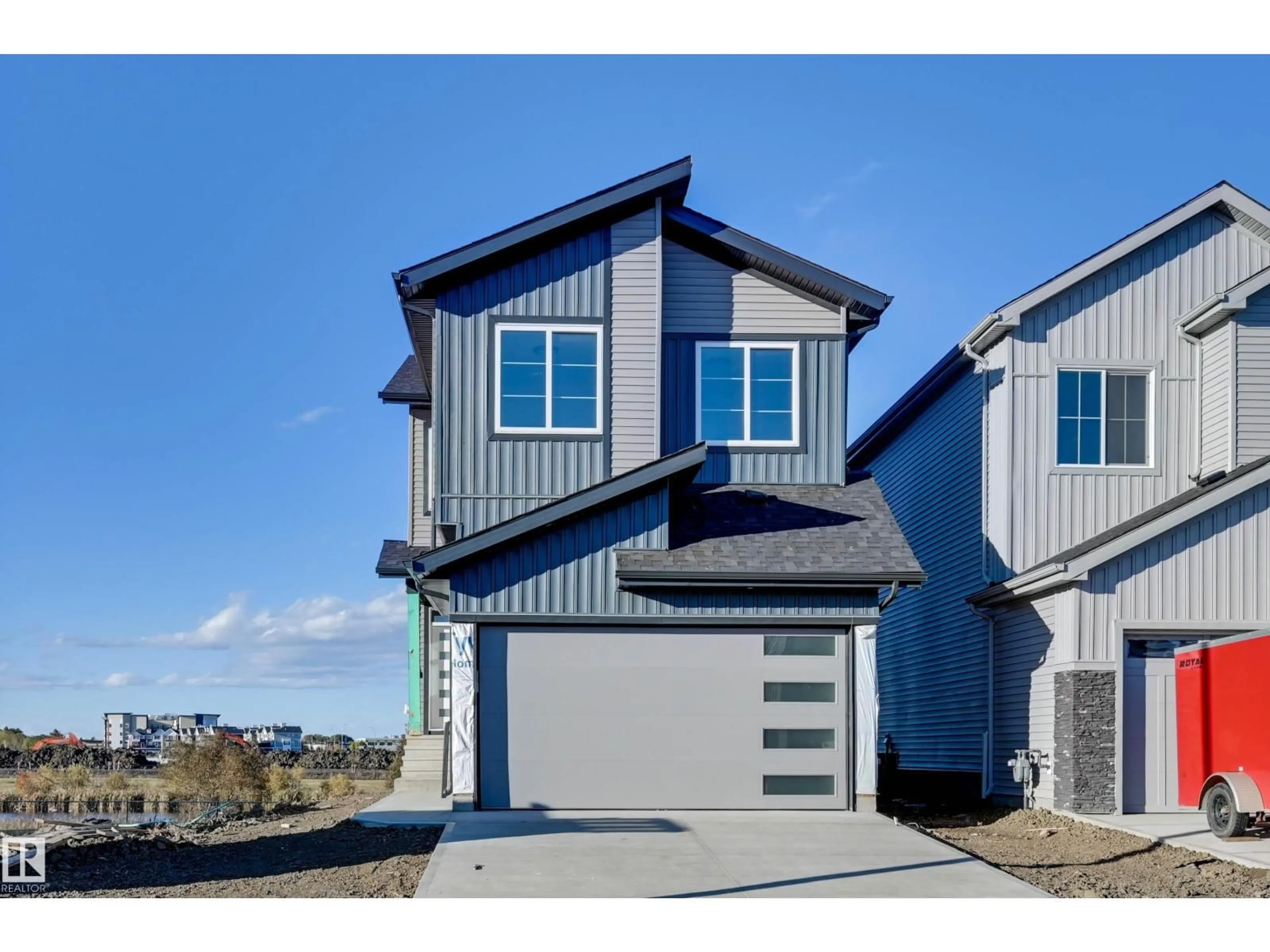 Home with vinyl exterior material, street for 194 ELLIOTT WD, Fort Saskatchewan Alberta T8L1V1