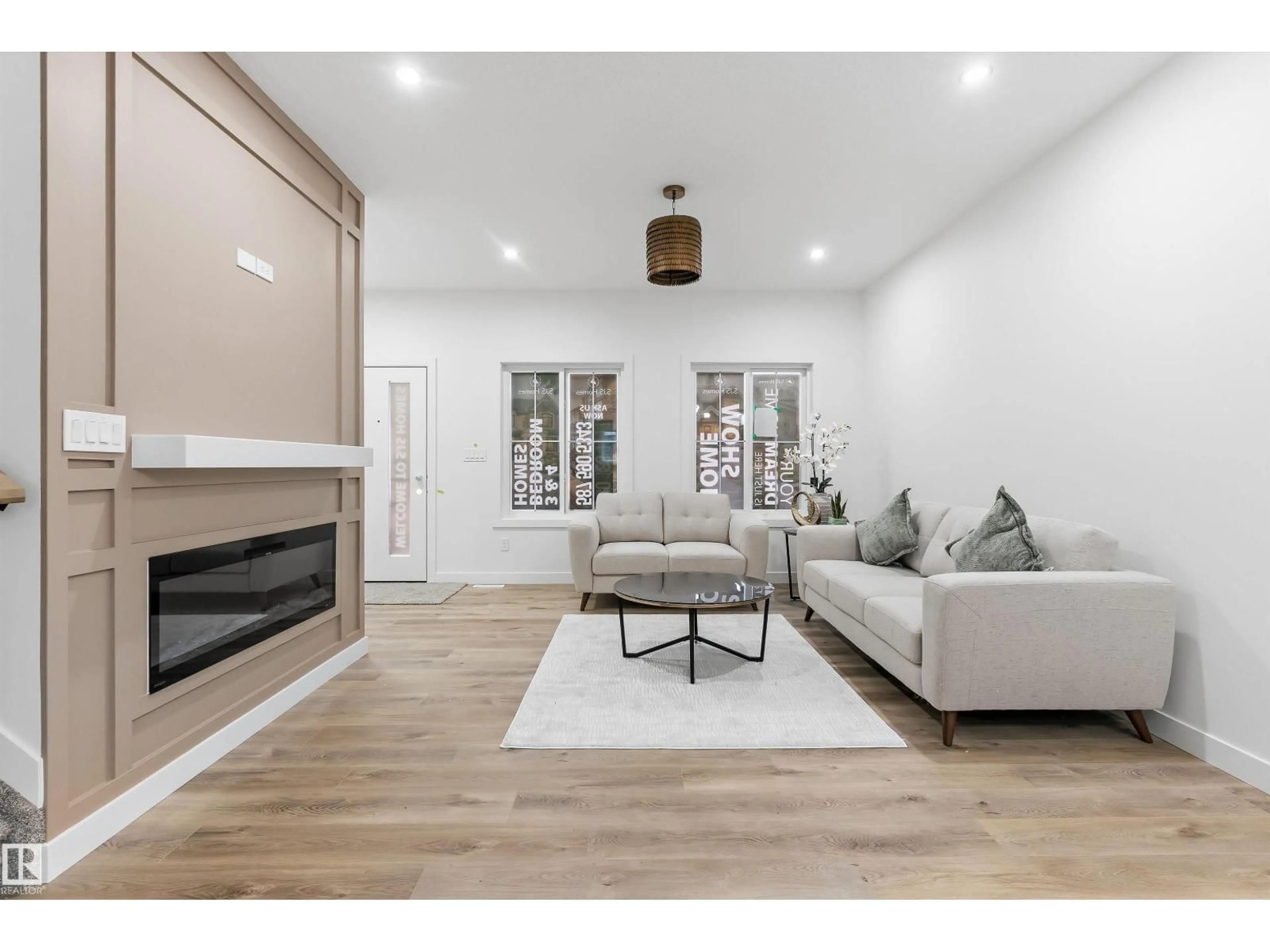 Living room with furniture, wood/laminate floor for 180 PACIFIC DR, Spruce Grove Alberta T7X4T1
