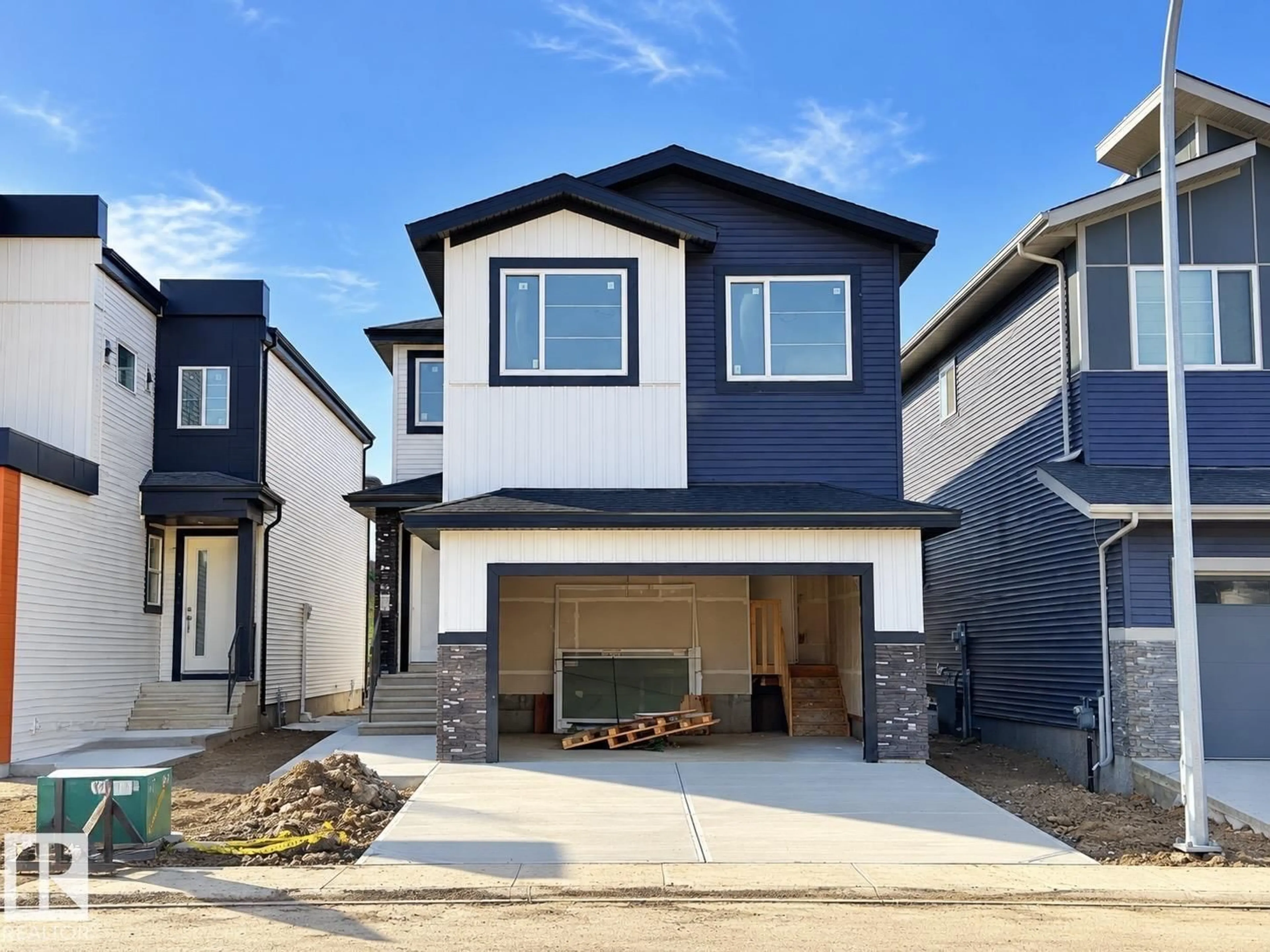 Home with vinyl exterior material, street for NW - 2019 156 AVE, Edmonton Alberta T5Y4N3
