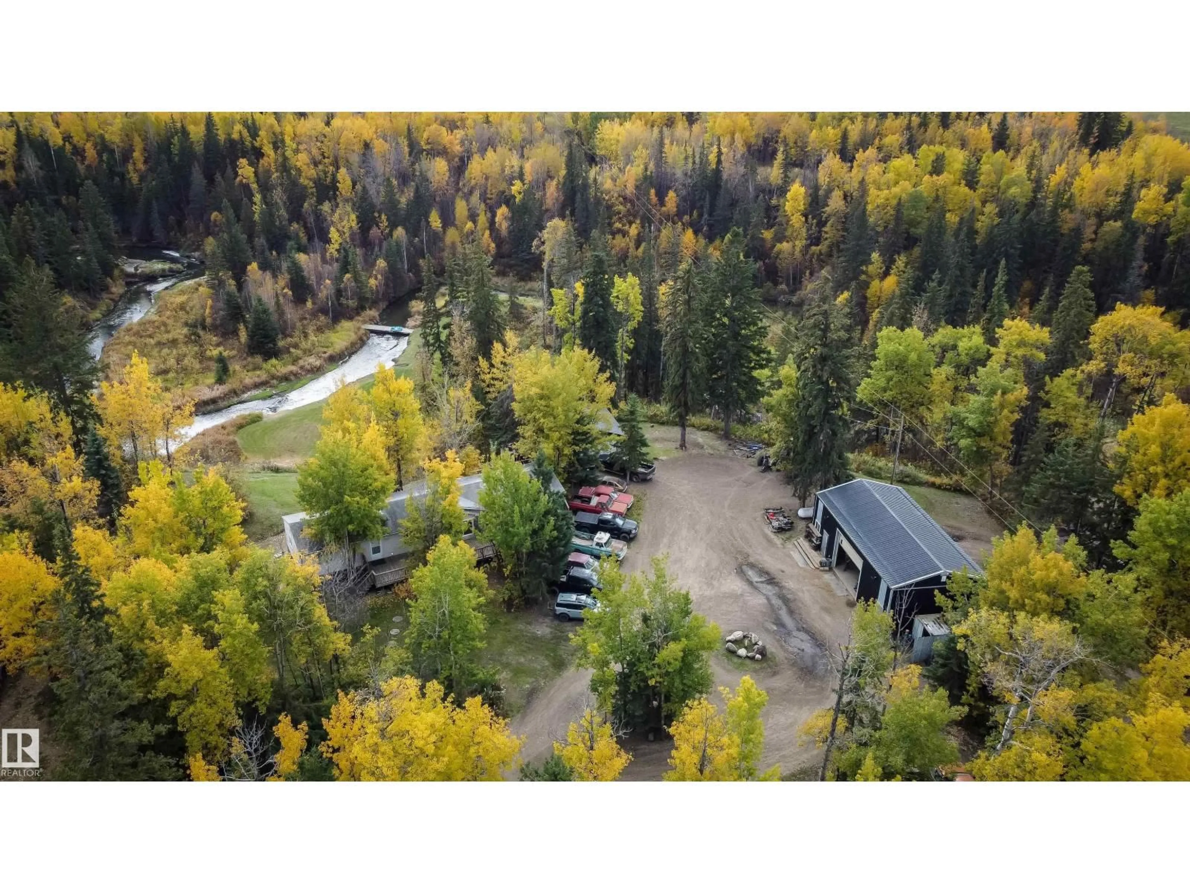 A pic from outside/outdoor area/front of a property/back of a property/a pic from drone, forest/trees view for 2331 TWP ROAD 552, Rural Lac Ste. Anne County Alberta T0E1A0