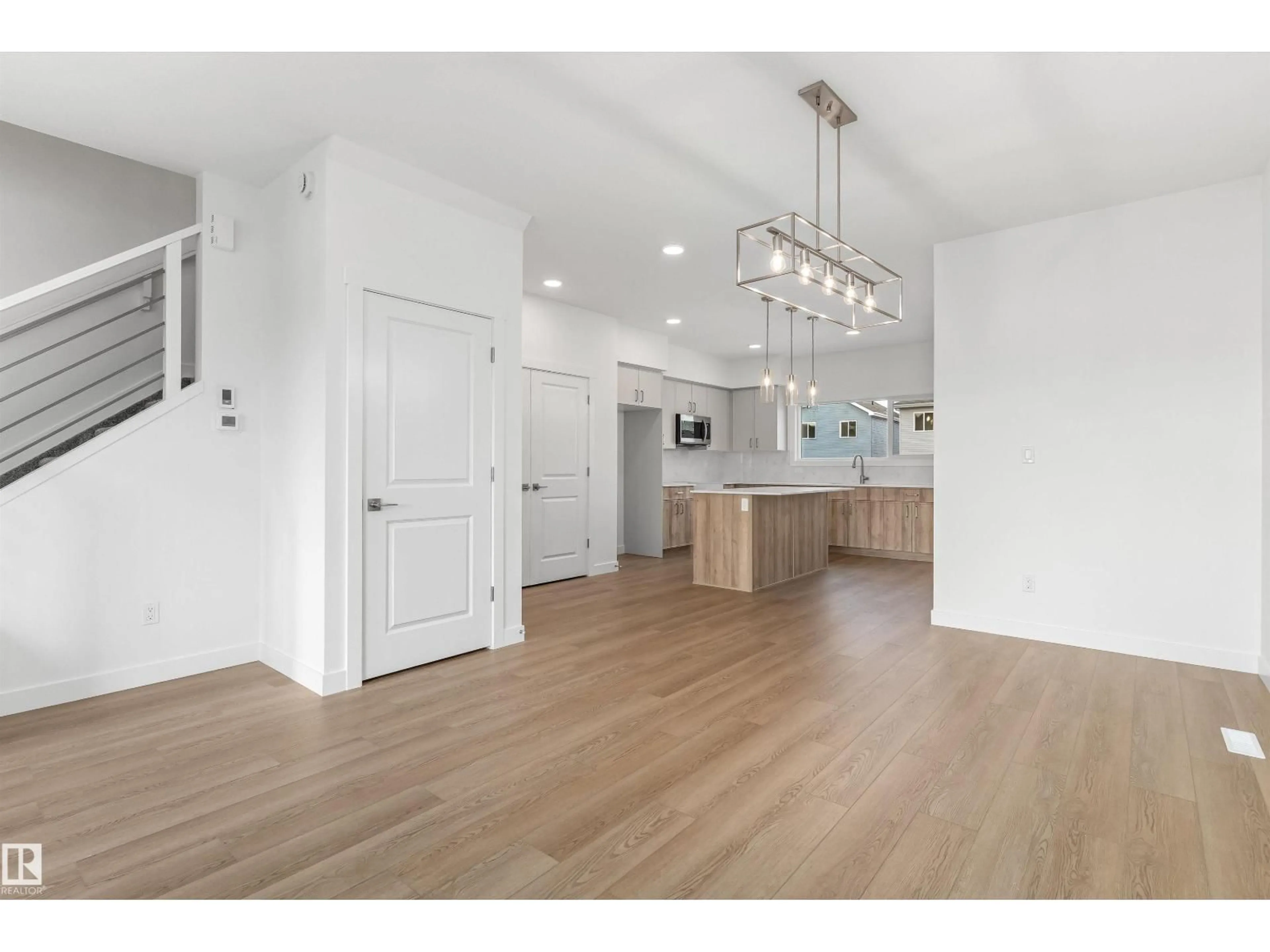 Open concept kitchen, wood/laminate floor for 1012 14 AV, Edmonton Alberta T6T2W8