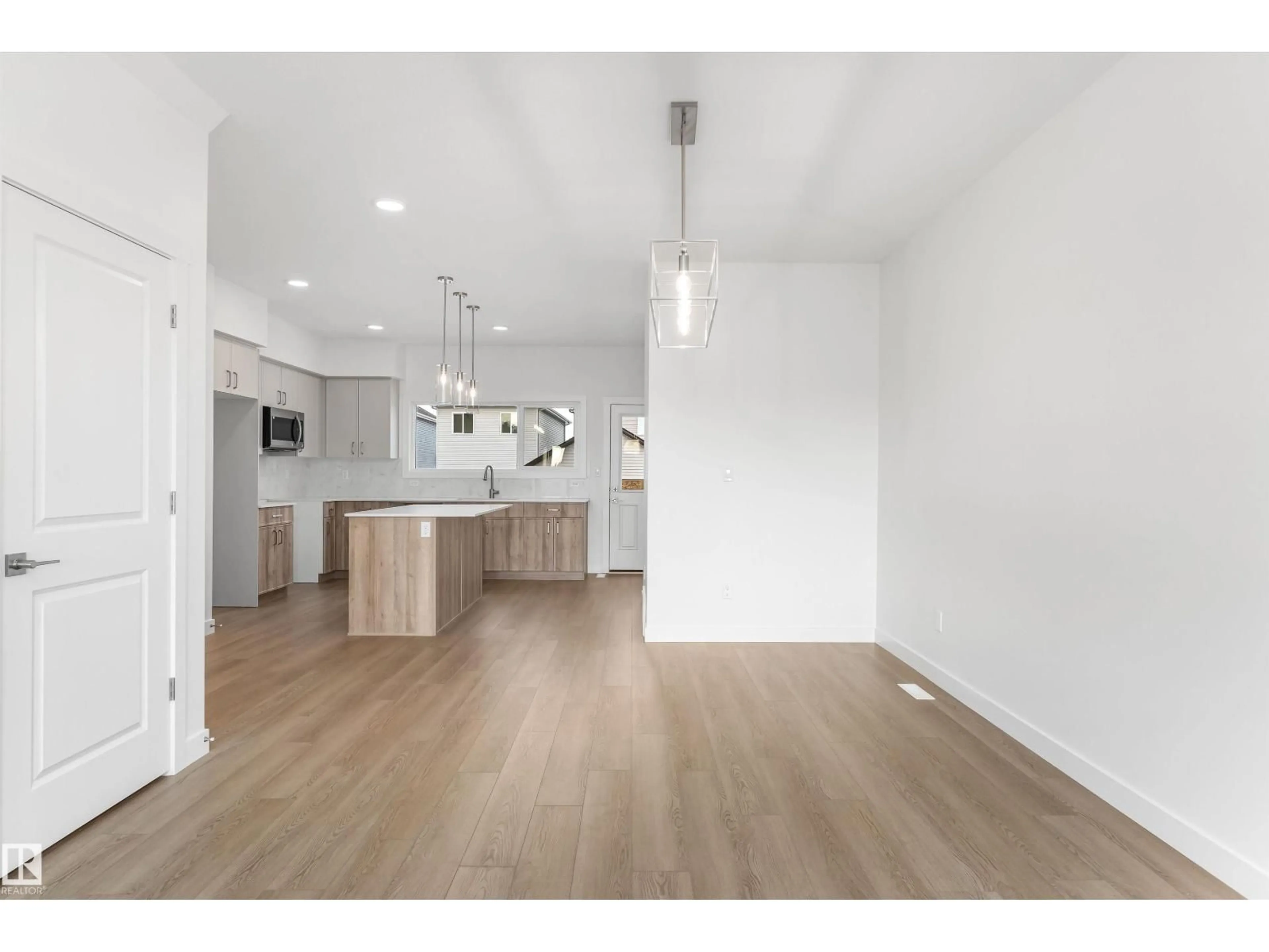 Open concept kitchen, wood/laminate floor for 1012 14 AV, Edmonton Alberta T6T2W8