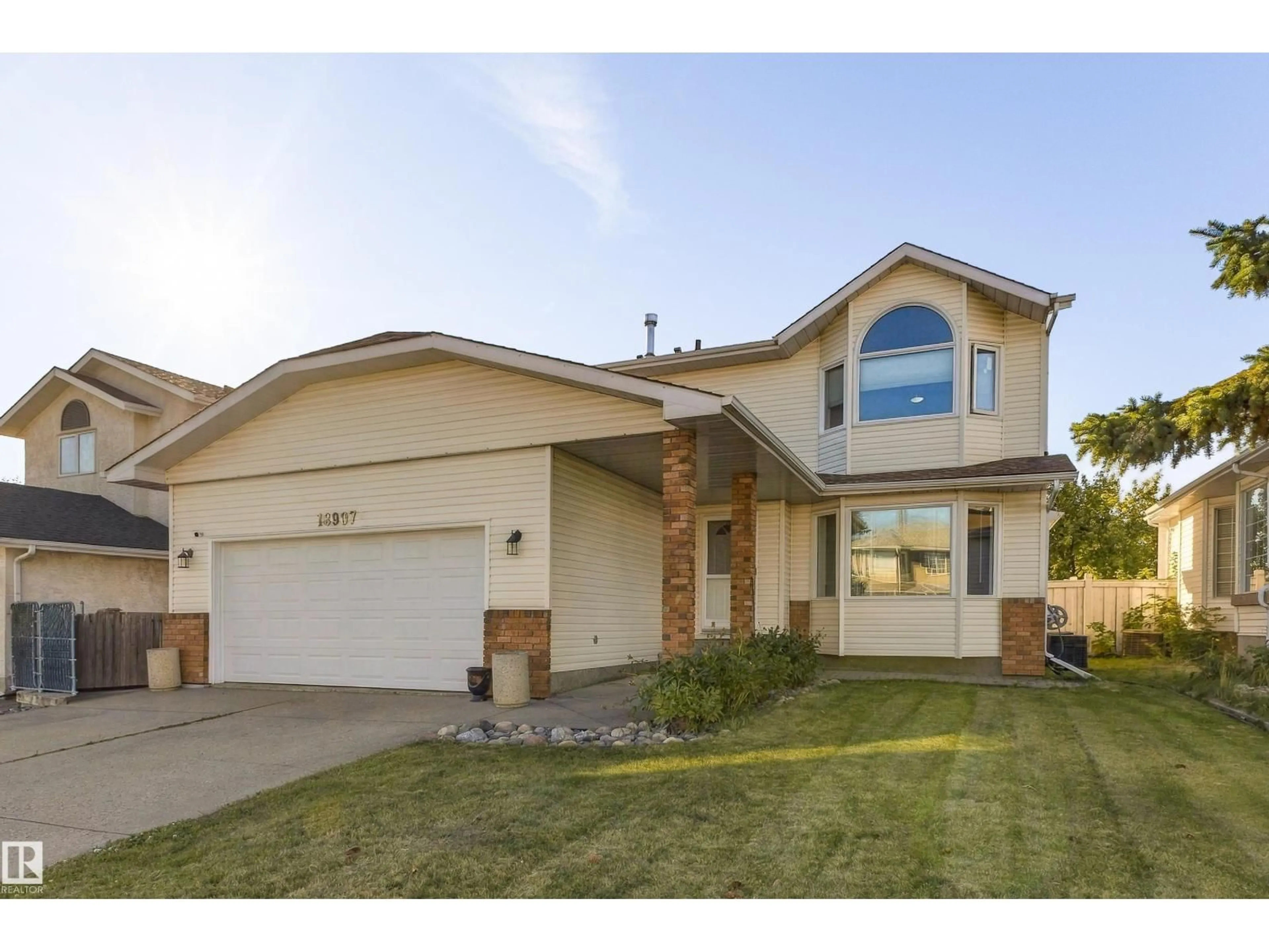 Home with vinyl exterior material, street for 18907 90 AV NW, Edmonton Alberta T5T5W2