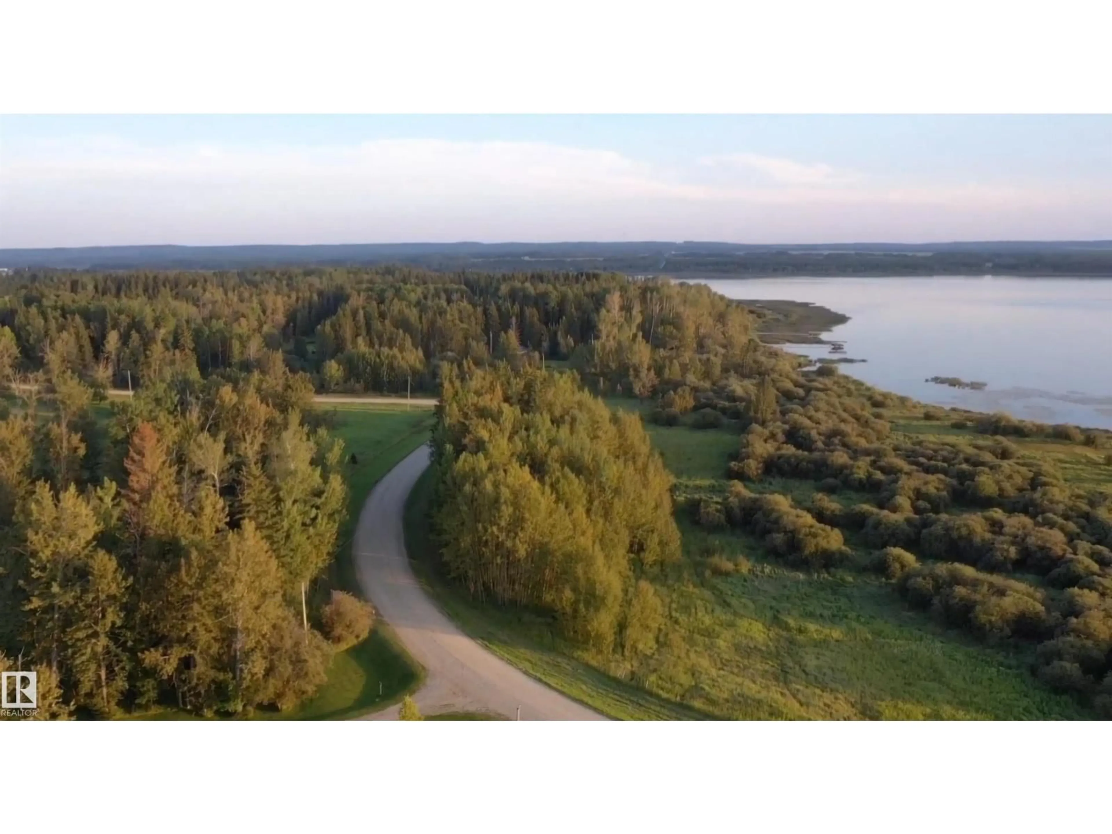 A pic from outside/outdoor area/front of a property/back of a property/a pic from drone, water/lake/river/ocean view for #3 - 55062 TWP ROAD 462, Rural Wetaskiwin County Alberta T0C0T0