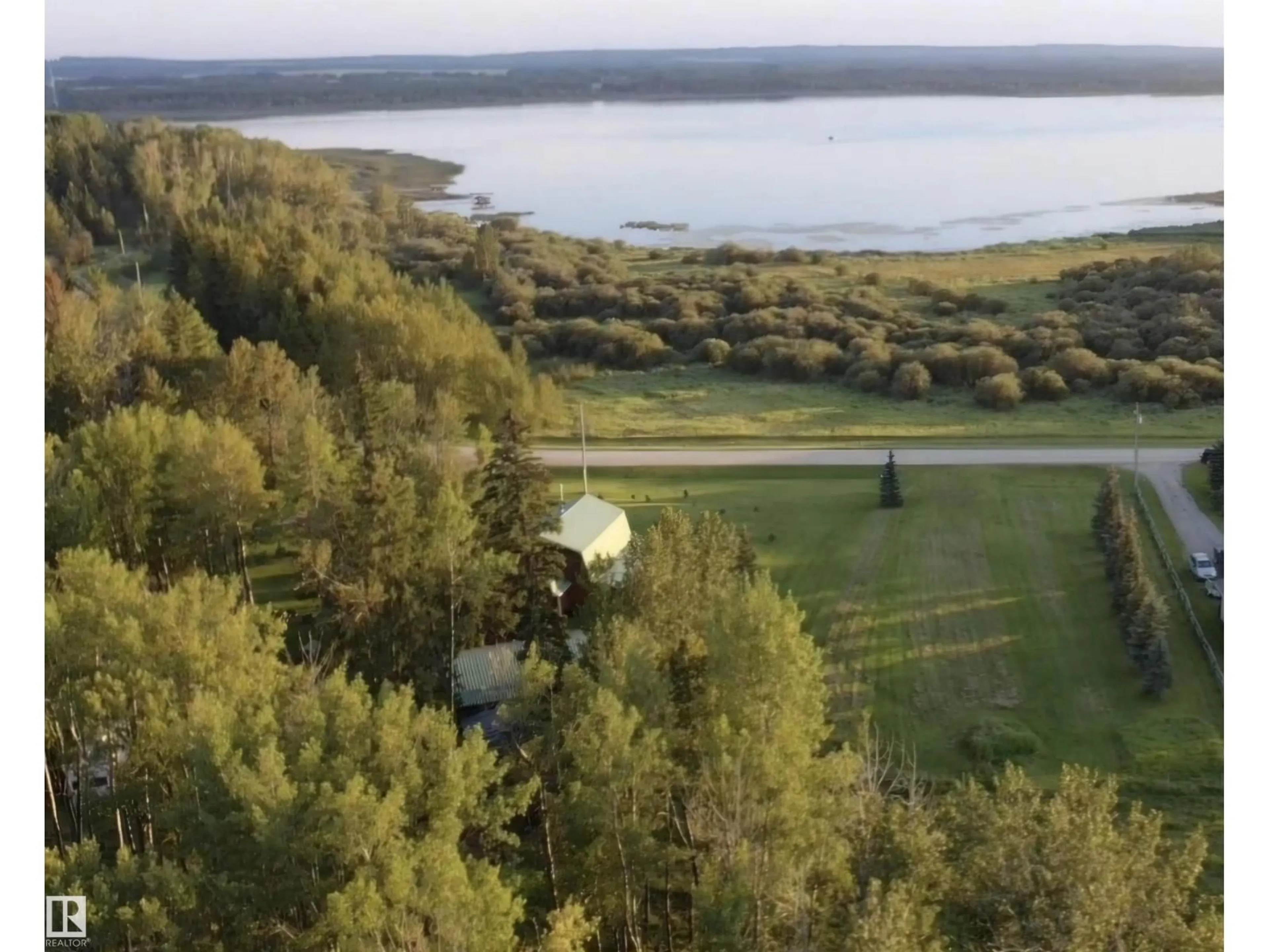 A pic from outside/outdoor area/front of a property/back of a property/a pic from drone, water/lake/river/ocean view for #3 - 55062 TWP ROAD 462, Rural Wetaskiwin County Alberta T0C0T0