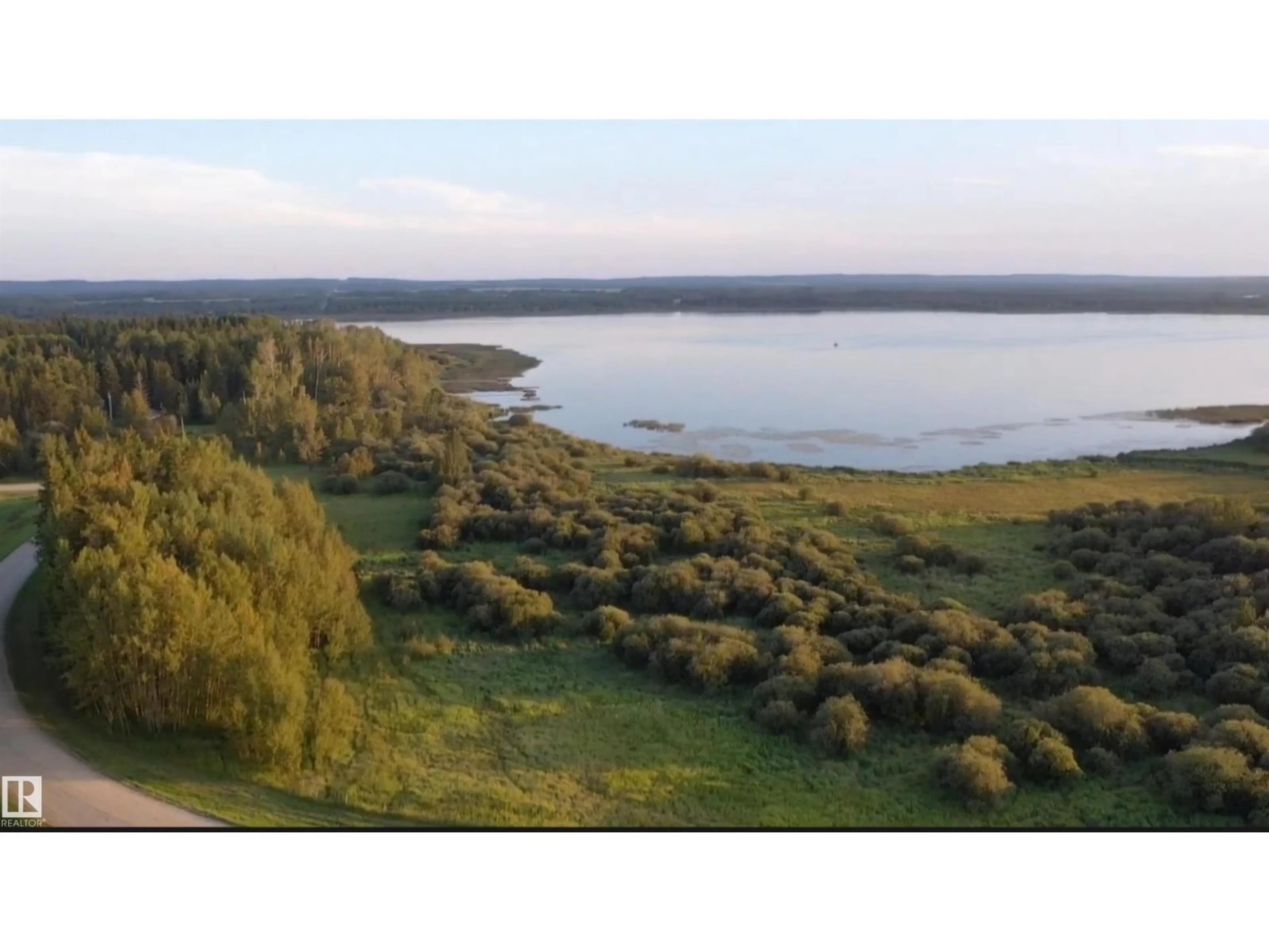 A pic from outside/outdoor area/front of a property/back of a property/a pic from drone, water/lake/river/ocean view for #3 - 55062 TWP ROAD 462, Rural Wetaskiwin County Alberta T0C0T0