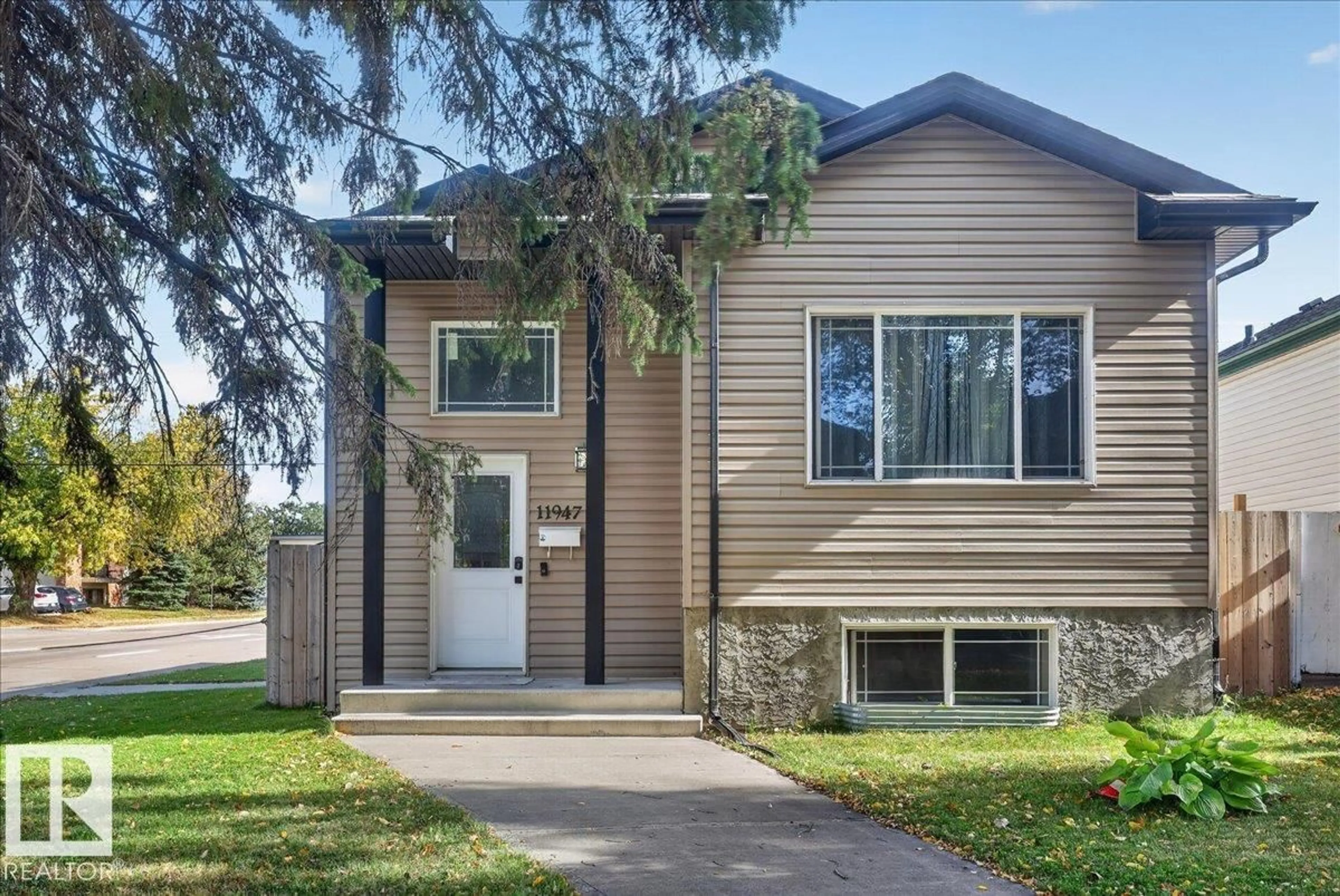 Home with vinyl exterior material, street for NW - 11947 67 ST, Edmonton Alberta T5B1M2