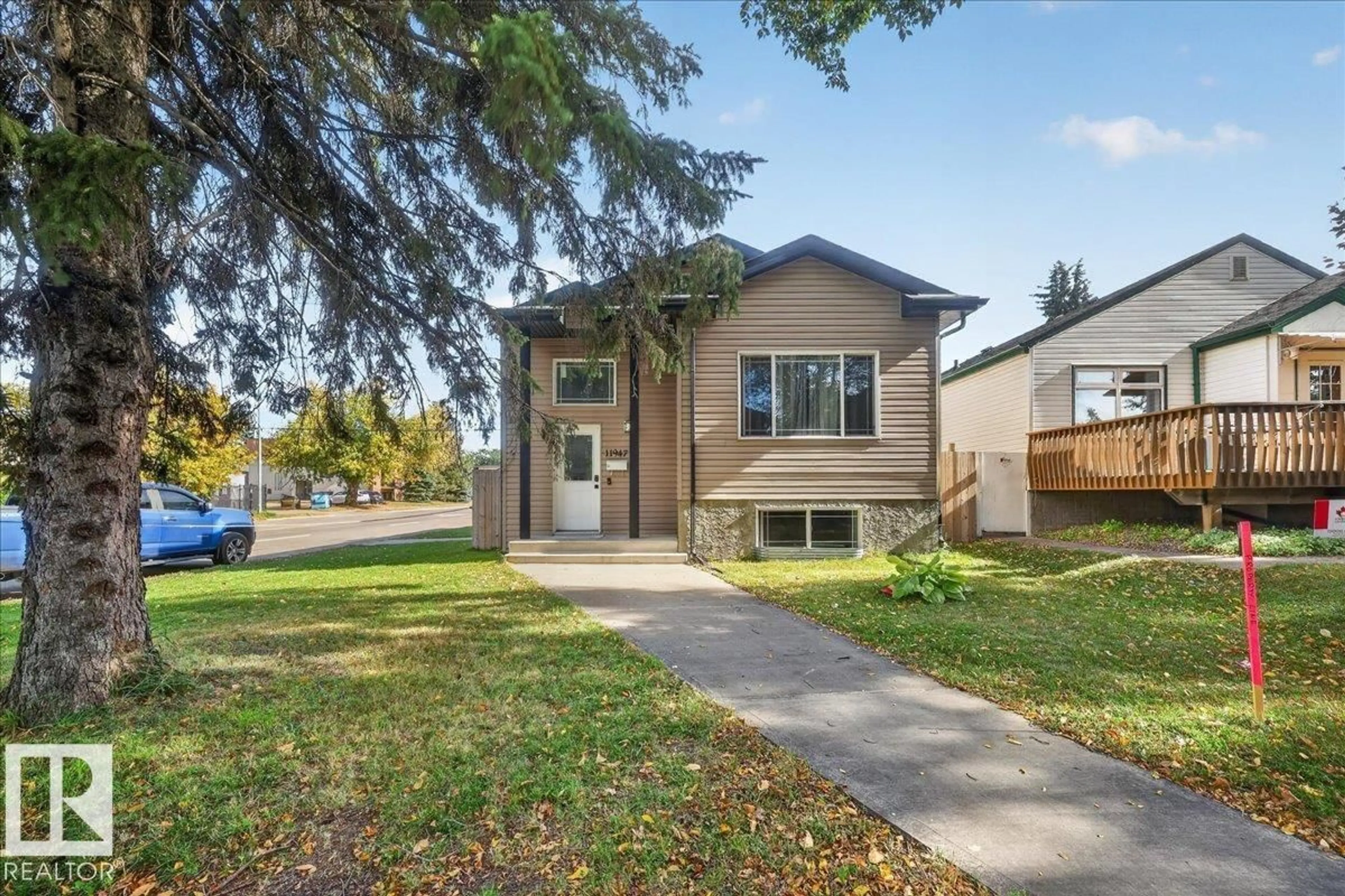 Home with vinyl exterior material, street for NW - 11947 67 ST, Edmonton Alberta T5B1M2