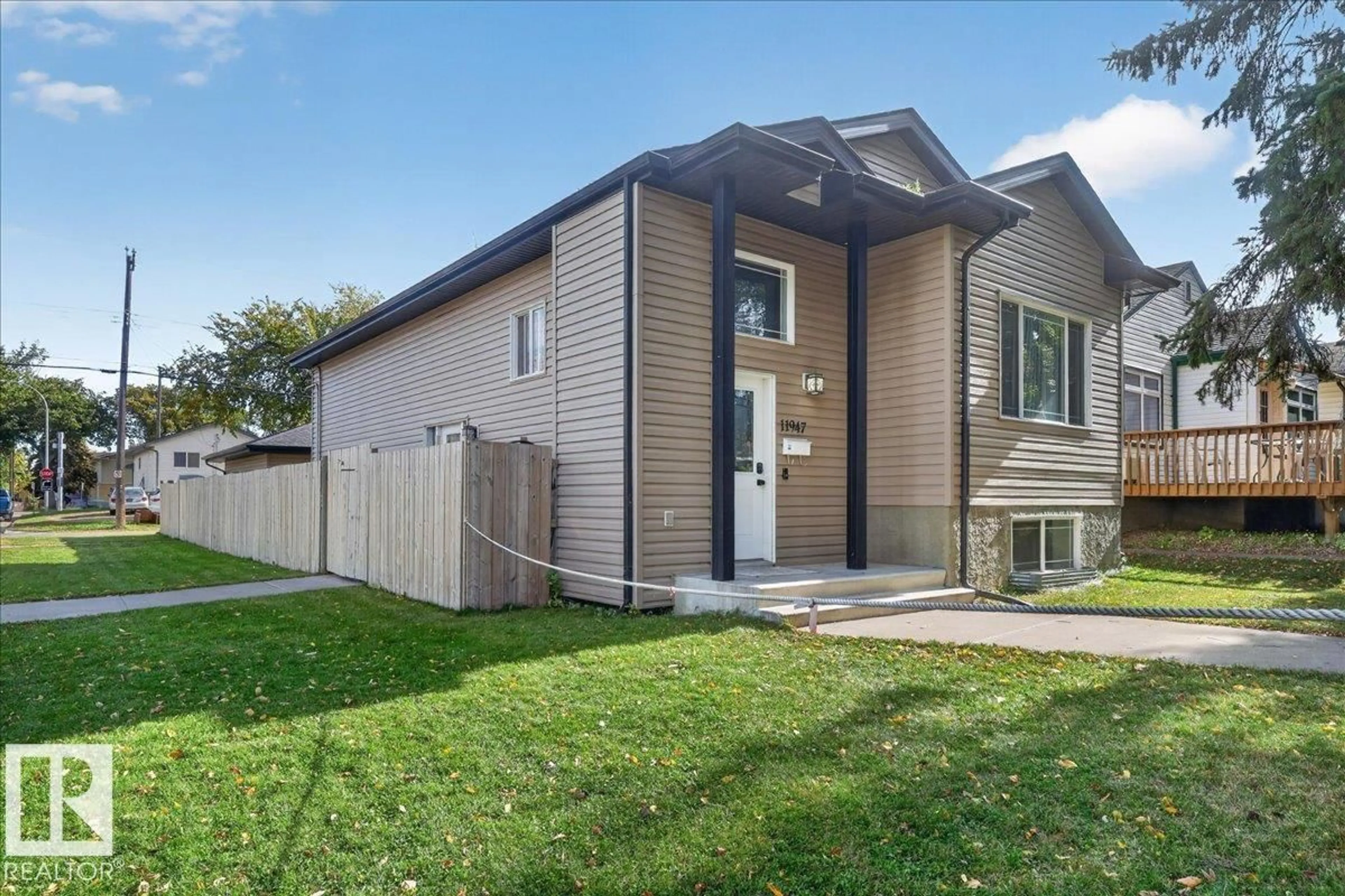 Home with vinyl exterior material, street for NW - 11947 67 ST, Edmonton Alberta T5B1M2