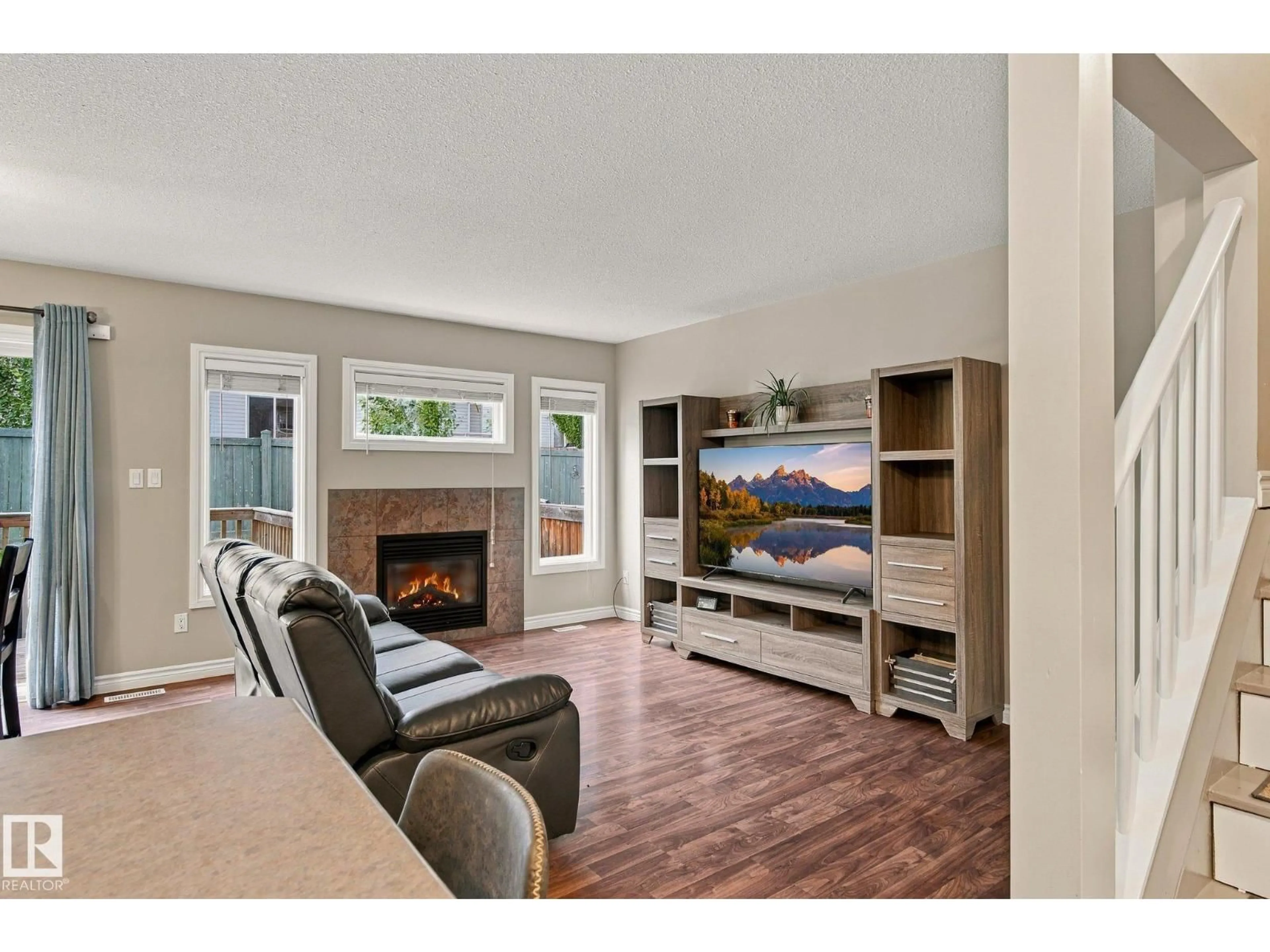 Living room with furniture, wood/laminate floor for 85 - 27 SPRING VILLAGE DR, Spruce Grove Alberta T7X0L2