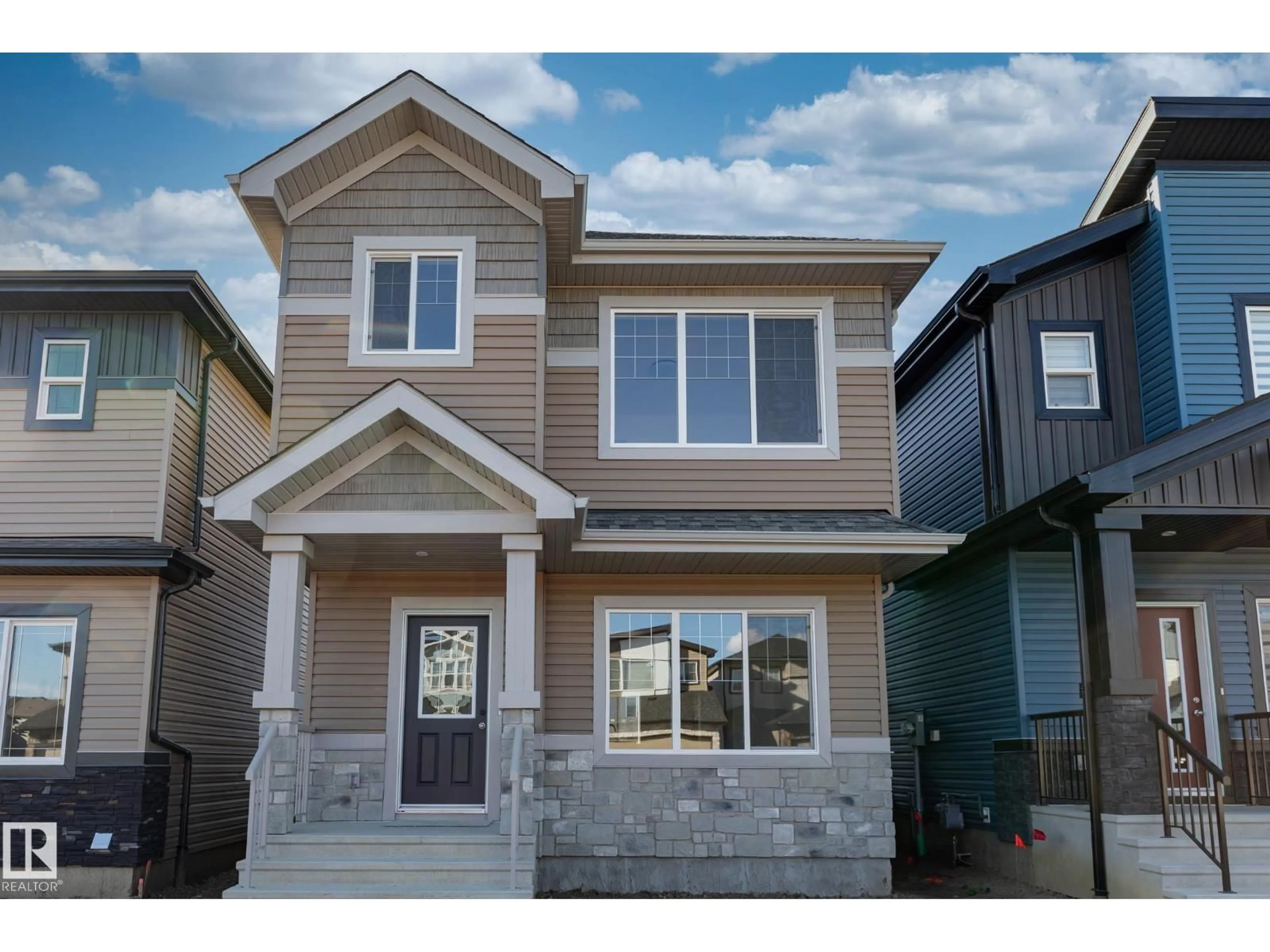 Home with vinyl exterior material, street for 213 WATTLE RD, Leduc Alberta T9E0V1