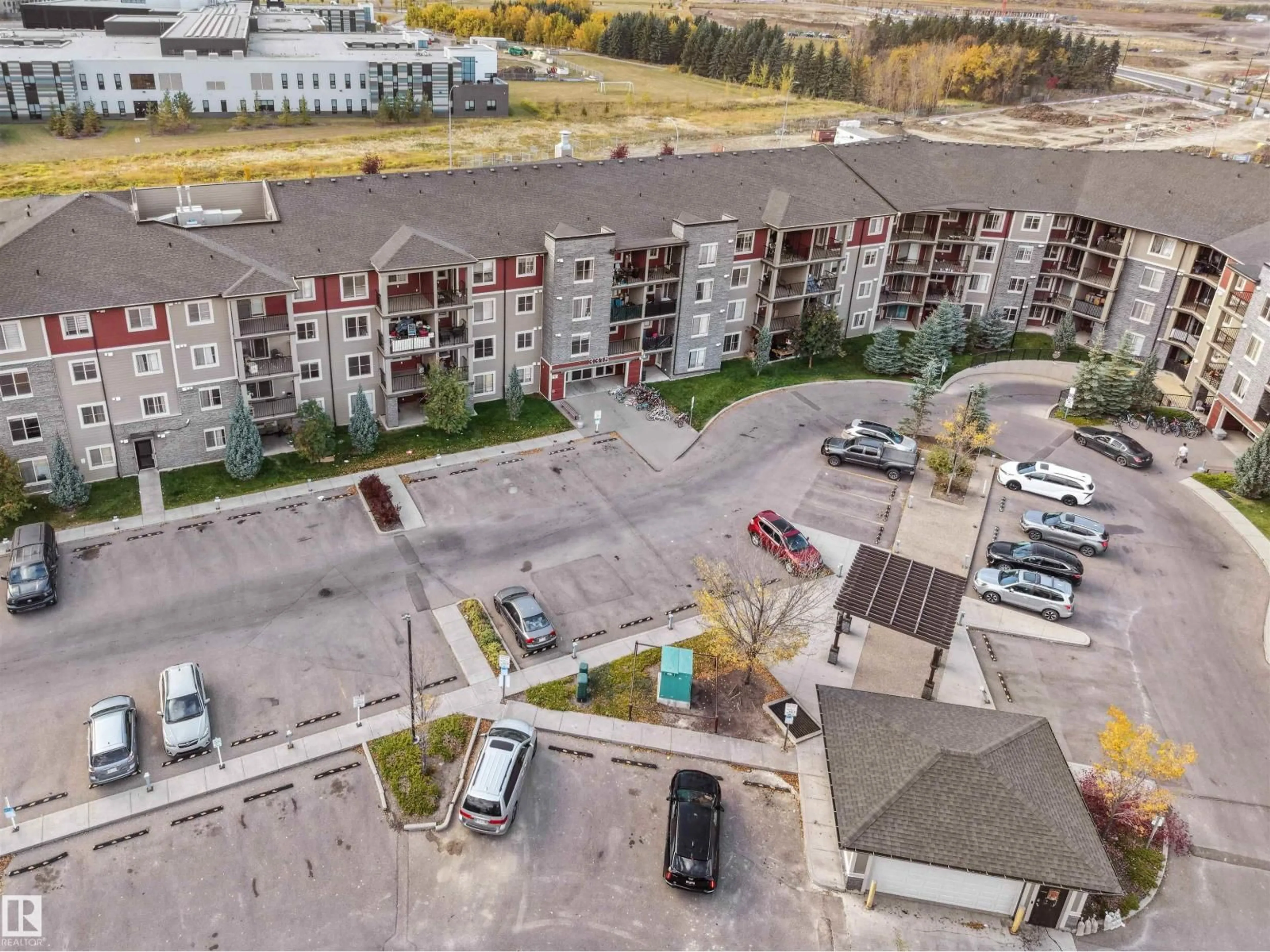 A pic from outside/outdoor area/front of a property/back of a property/a pic from drone, unknown for #119 - 3315 JAMES MOWATT TR, Edmonton Alberta T6W3L9