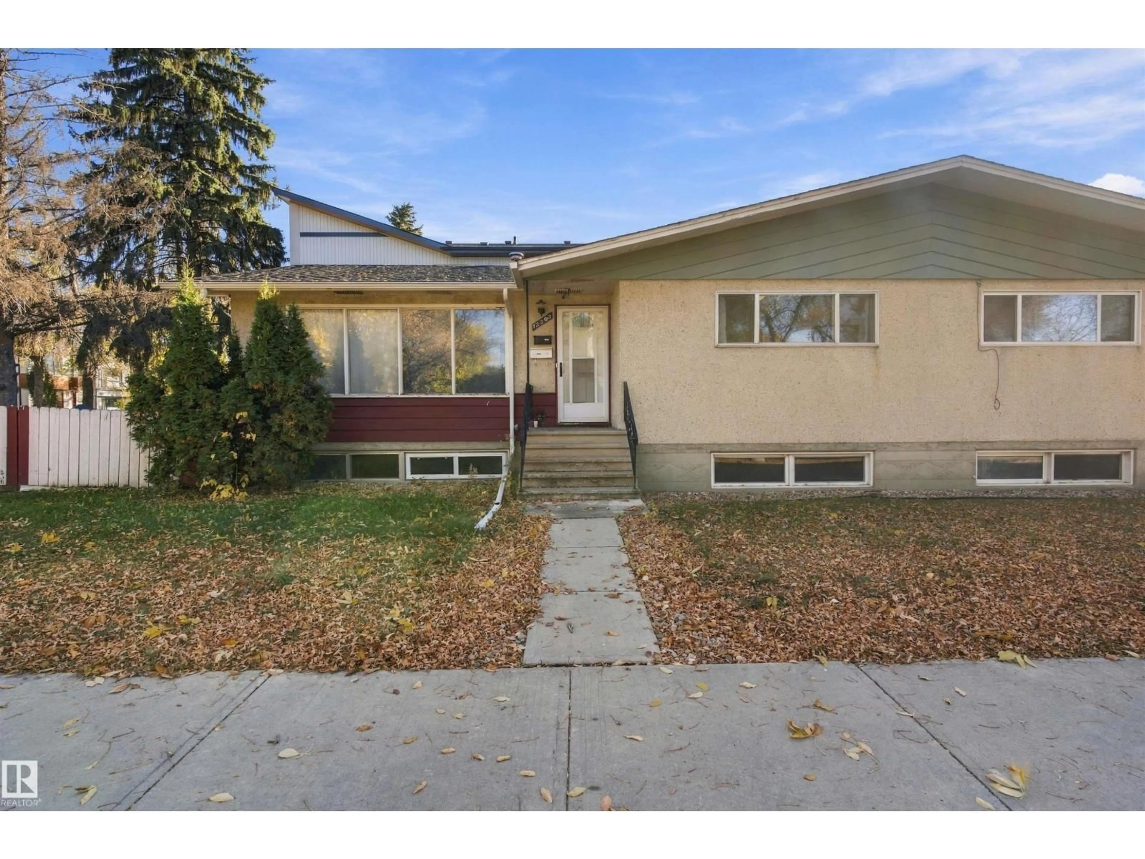 Home with vinyl exterior material, street for NW - 12303 115 AV, Edmonton Alberta T5M2Z7