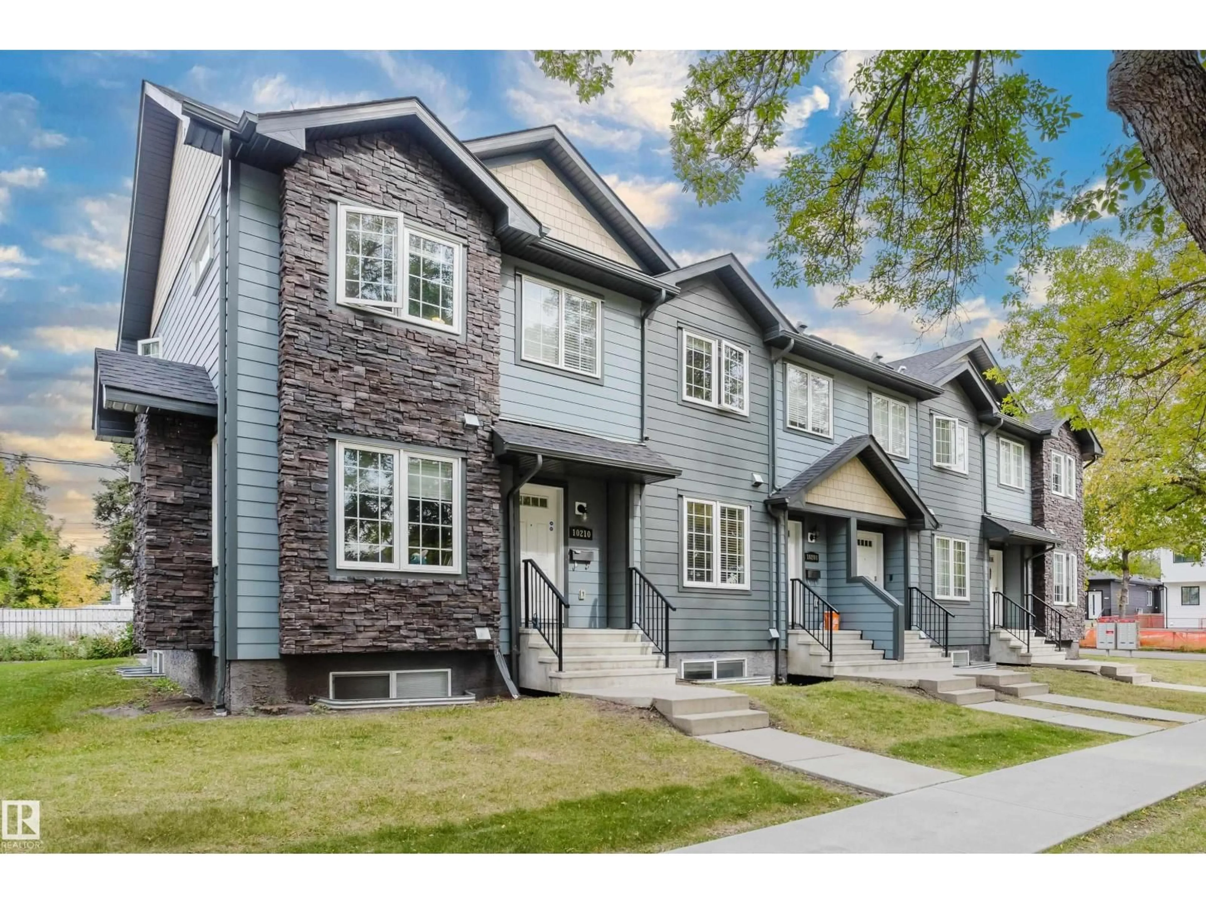 Home with vinyl exterior material, street for NW - 10204 - 10210 113 AV, Edmonton Alberta T5G0W9