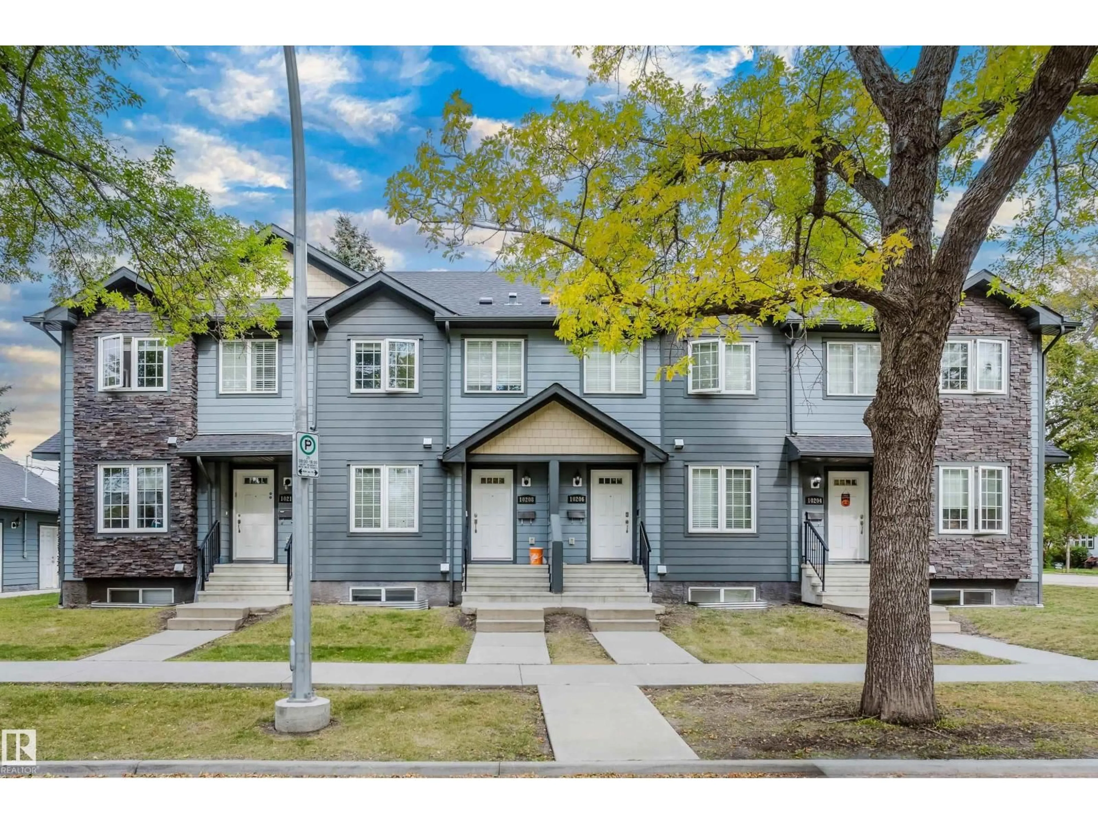 Home with vinyl exterior material, street for NW - 10204 - 10210 113 AV, Edmonton Alberta T5G0W9