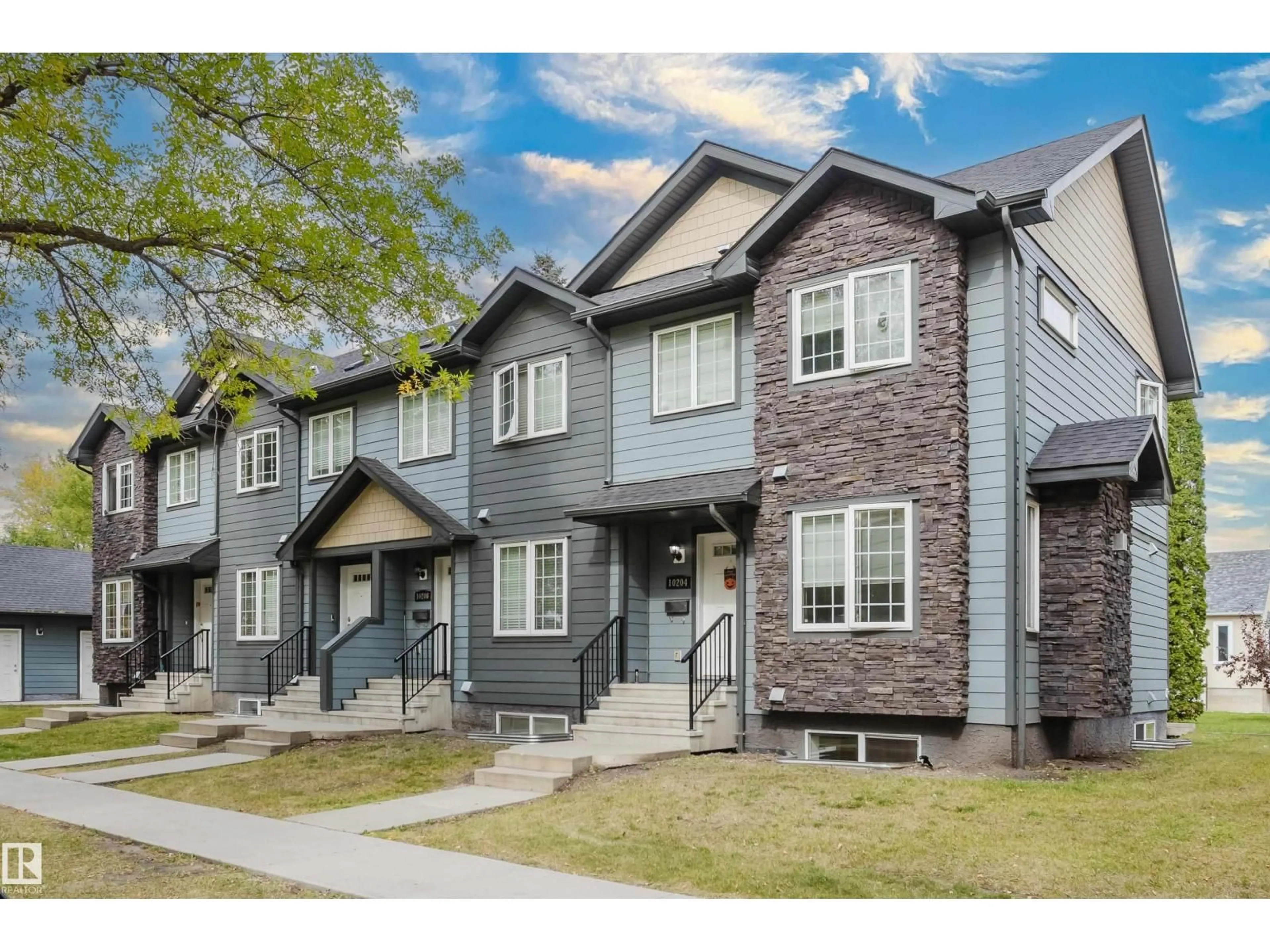 Home with vinyl exterior material, street for NW - 10204 - 10210 113 AV, Edmonton Alberta T5G0W9