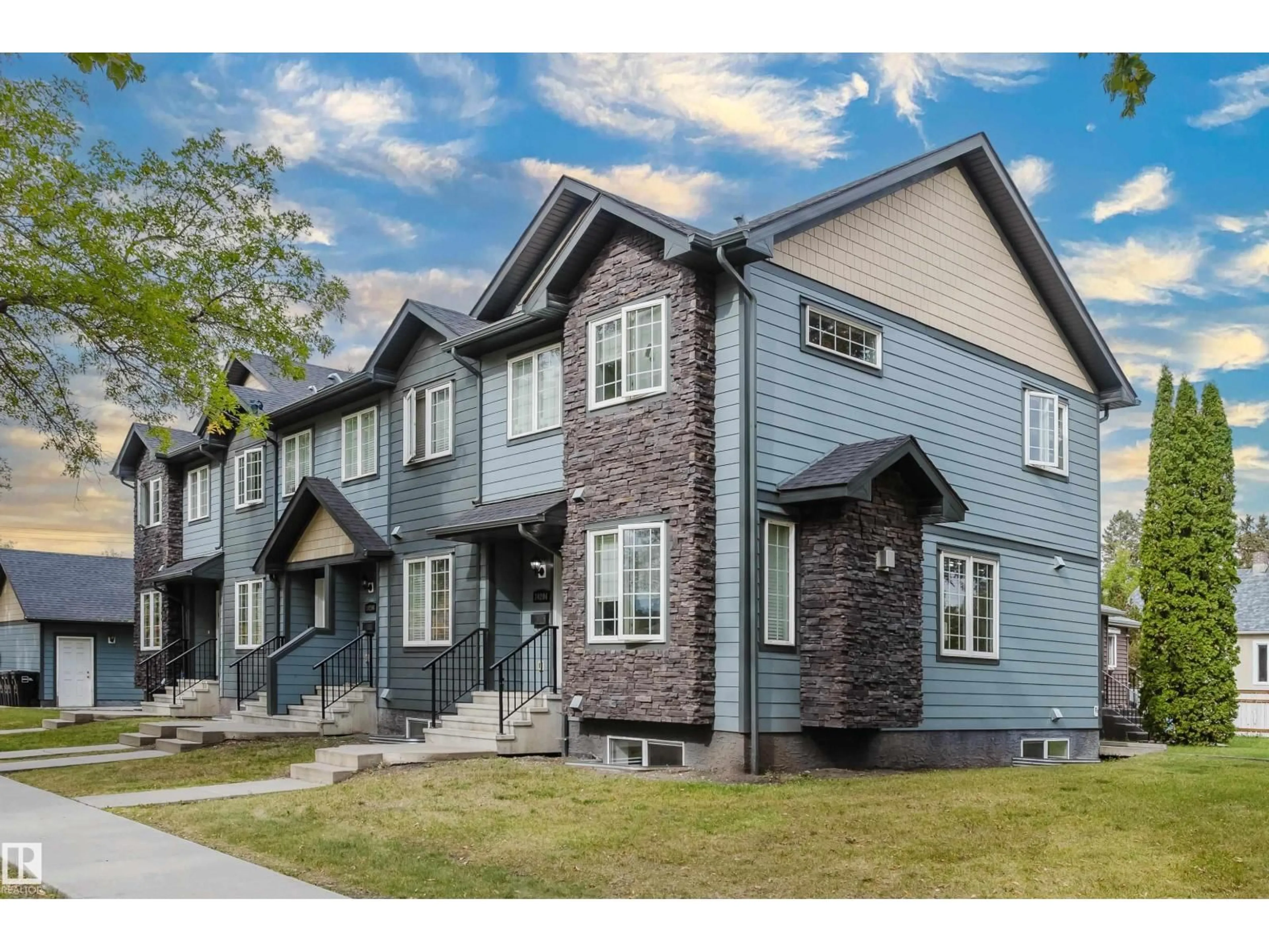 Home with vinyl exterior material, street for NW - 10204 - 10210 113 AV, Edmonton Alberta T5G0W9